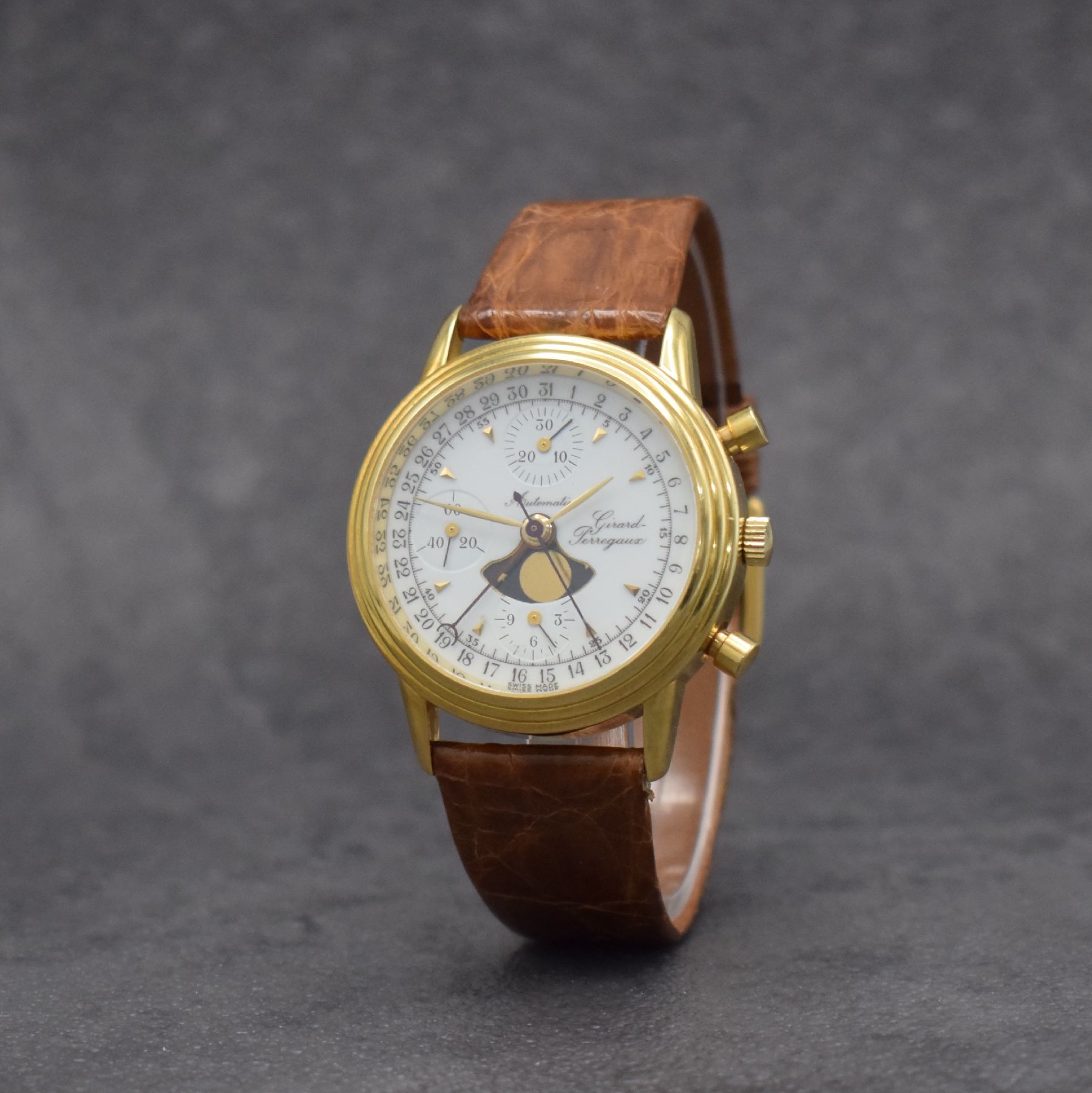 Detail b: GIRARD PERREGAUX Herrenarmbanduhr in GG 750/000 mit Chronograph, Mondphase & Datum, Schweiz um 1990, Automatik, beids. vergl. Gehäuse, Boden gedr., ...