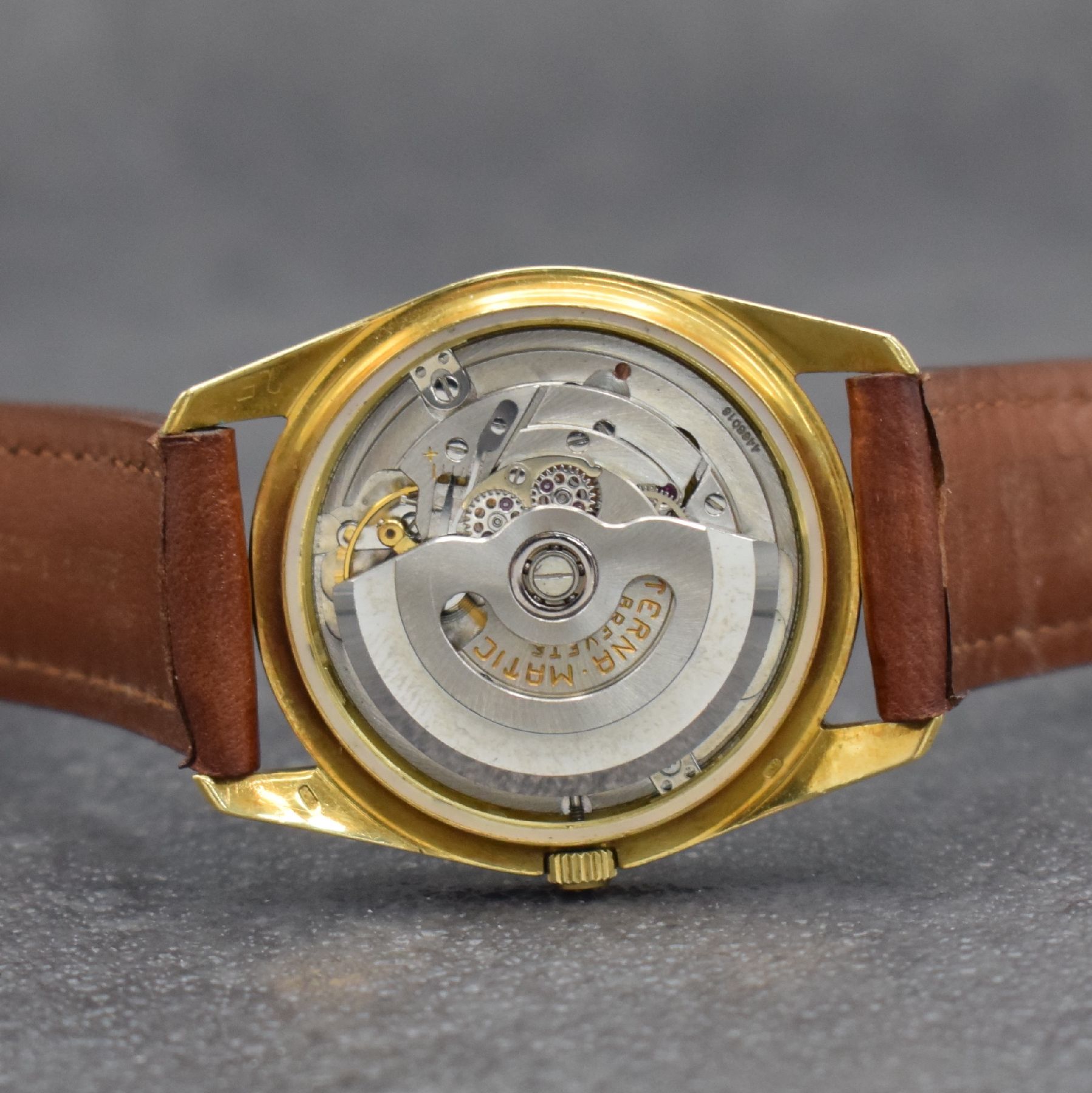 Detail g: ETERNA Chronometer Herrenarmbanduhr in GG 750/000, Schweiz um 1960, Automatik, Boden m. Wappen geschr., gold. Zifferbl. m. aufgel. Std.-Ind., gold. ...
