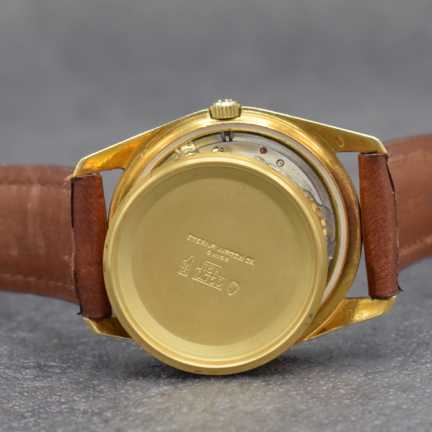 Detail h: ETERNA Chronometer Herrenarmbanduhr in GG 750/000, Schweiz um 1960, Automatik, Boden m. Wappen geschr., gold. Zifferbl. m. aufgel. Std.-Ind., gold. ...