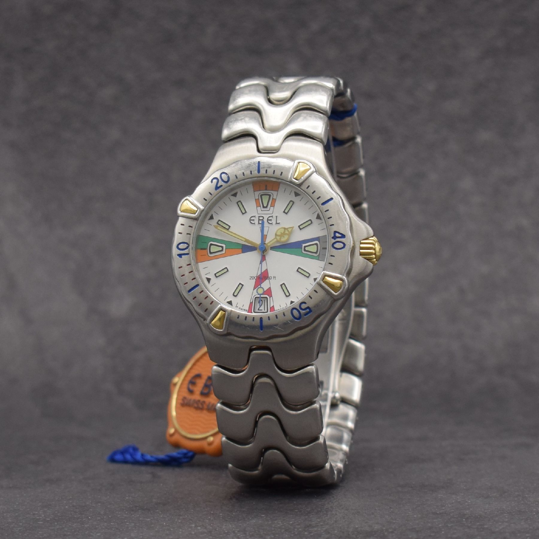 Detail b: EBEL Sportwave Armbanduhr, quarz, Ref. 6187531, verschr. Geh. in Stahl inkl. Gliederband. m. dopp. Faltschl., Reiter der Lünette & Krone in Gold, ...