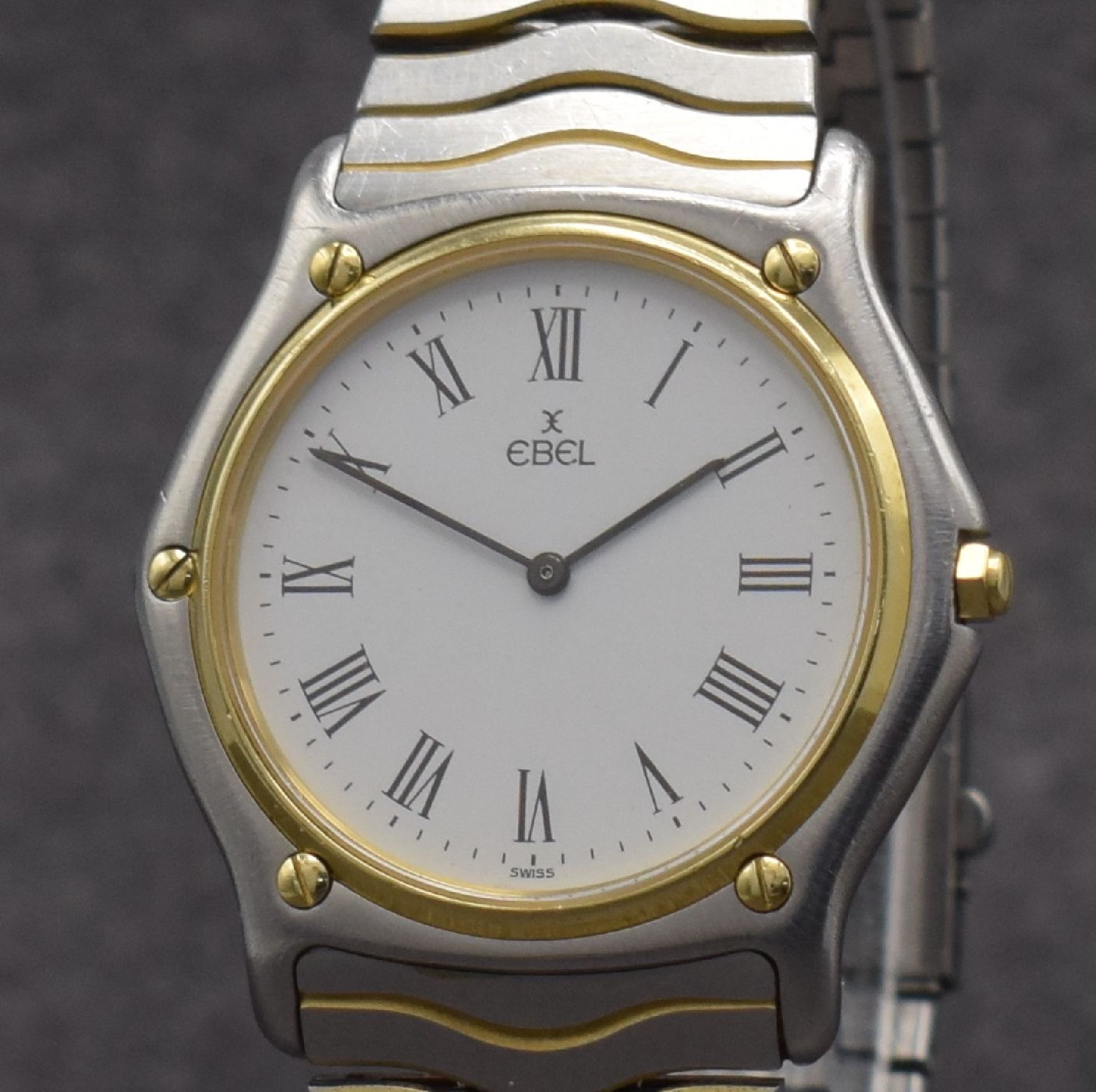 Detail c: EBEL Sport Classique Armbanduhr, Schweiz um 1985, quarz, Stülpgeh. in Edelstahl, Lünette in GG, Stahlbd. stark verschl., weißes Zifferbl. m. röm. ...