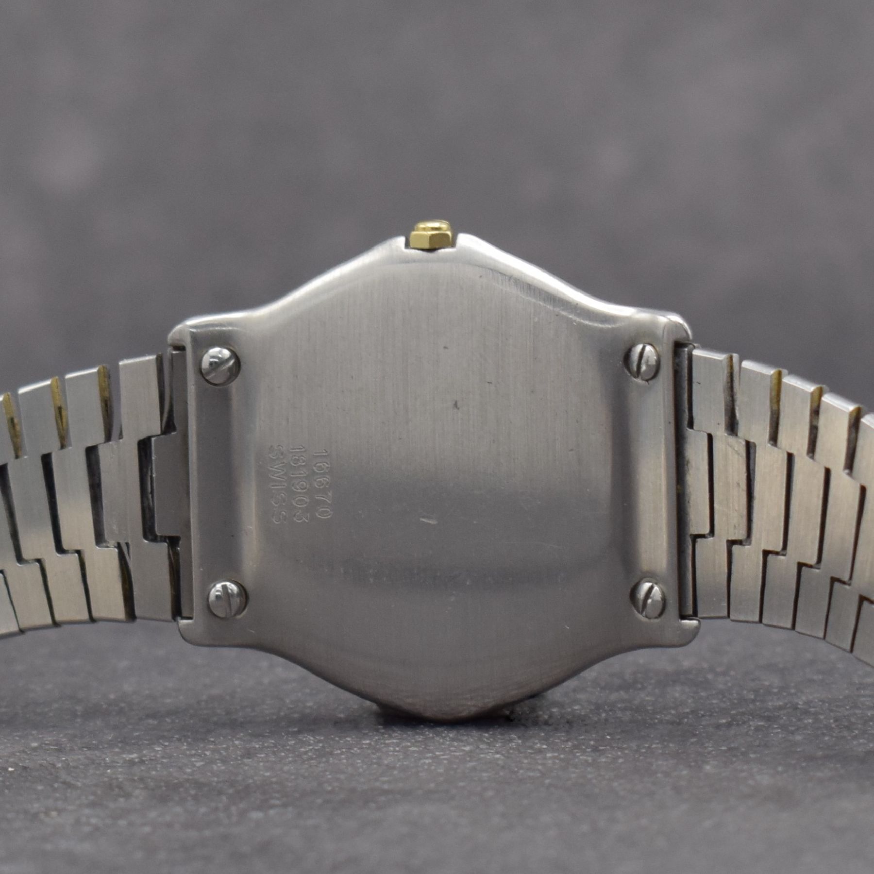 Detail f: EBEL Sport Classique Armbanduhr, Schweiz um 1985, quarz, Stülpgeh. in Edelstahl, Lünette in GG, Stahlbd. stark verschl., weißes Zifferbl. m. röm. ...