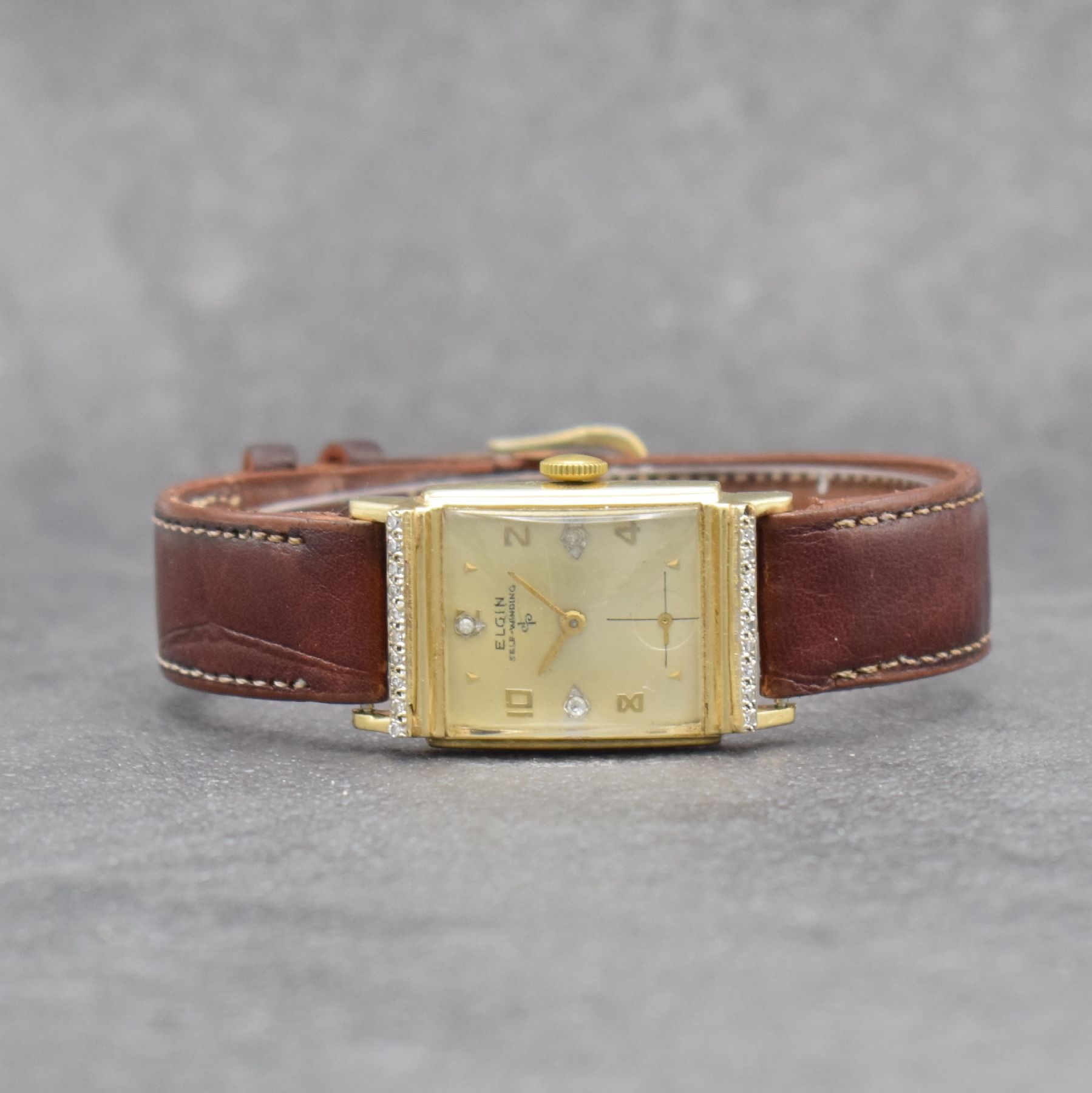 LORD ELGIN Herrenarmbanduhr in GG 585/000, USA 1940er Jahre, Handaufzug, Boden aufgedr., nachtr. m. 3 Diamantindizes bes. Zifferbl. m. Fehldruck ...