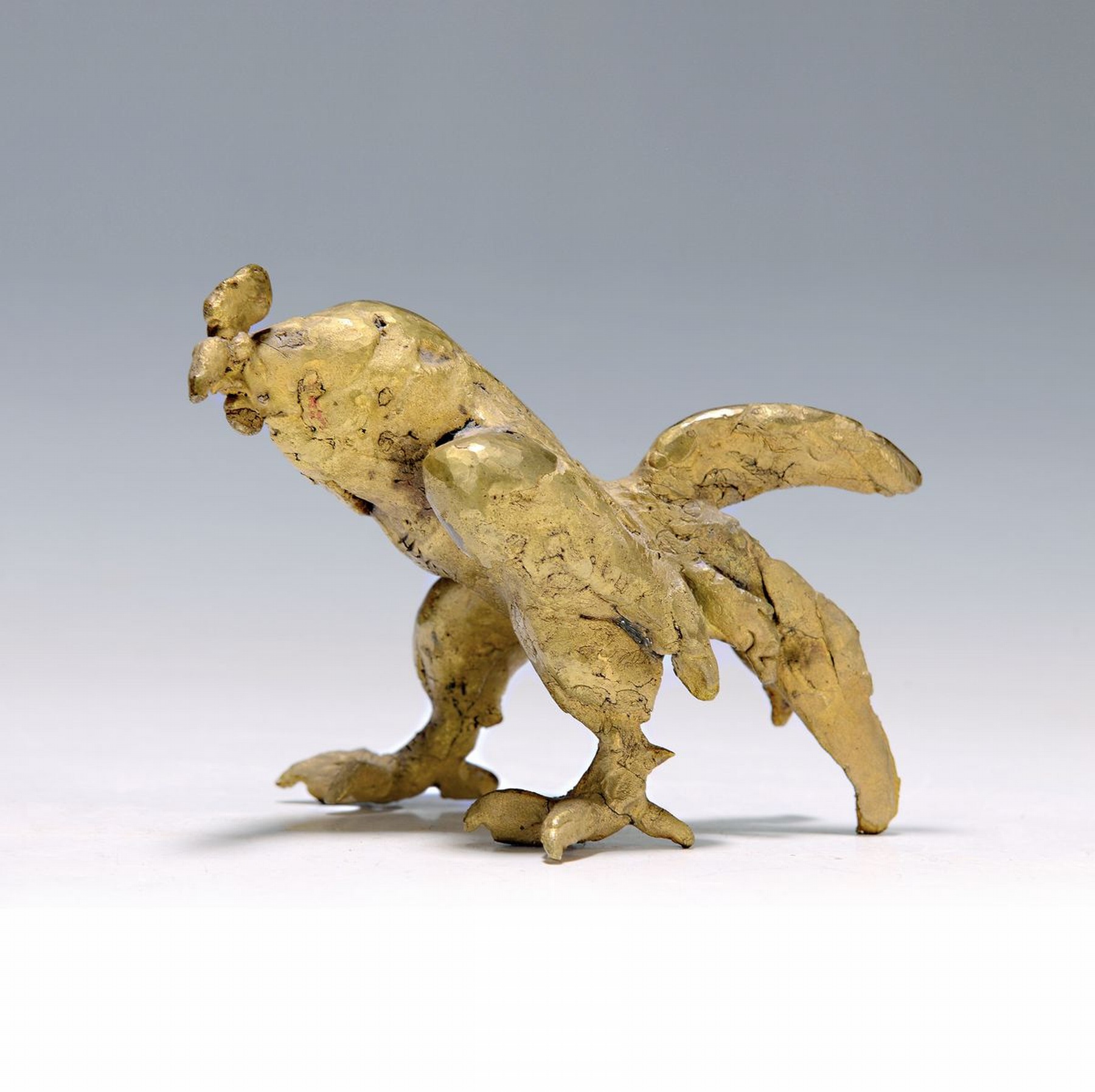 Prof. Erich Koch, 1924 Roßbach/Pfalz - 2014 München, kleiner Hahn, Bronze, am Bauch signiert, ca. 10.5 x 14 cm