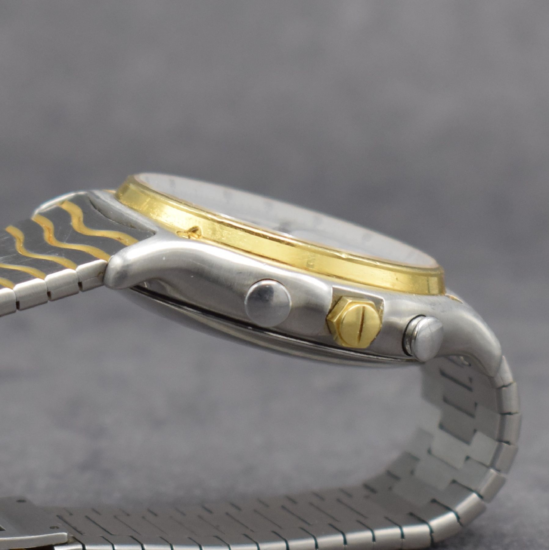 Detail e: EBEL Herrenchronograph mit El Primero Werk in Stahl/Gold Referenz 1134901, Schweiz um 1990, Automatik, Boden aufgedr., orig. Wellengliederband m. ...