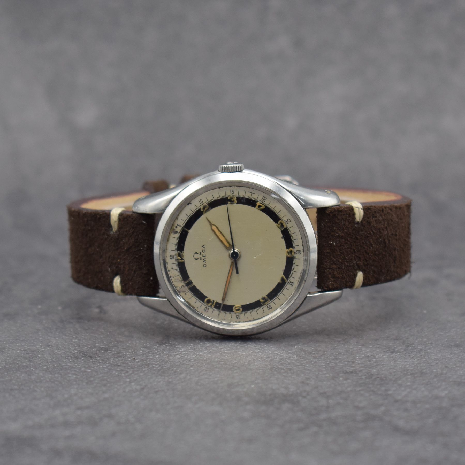 OMEGA Herrenarmbanduhr Kal. 30 T2 SC PC in Stahl, Schweiz um 1950, Handaufzug, Ref. 2504-2, Boden & Glasrand aufgedr., silb. 2- farb. Zifferbl. m. ...
