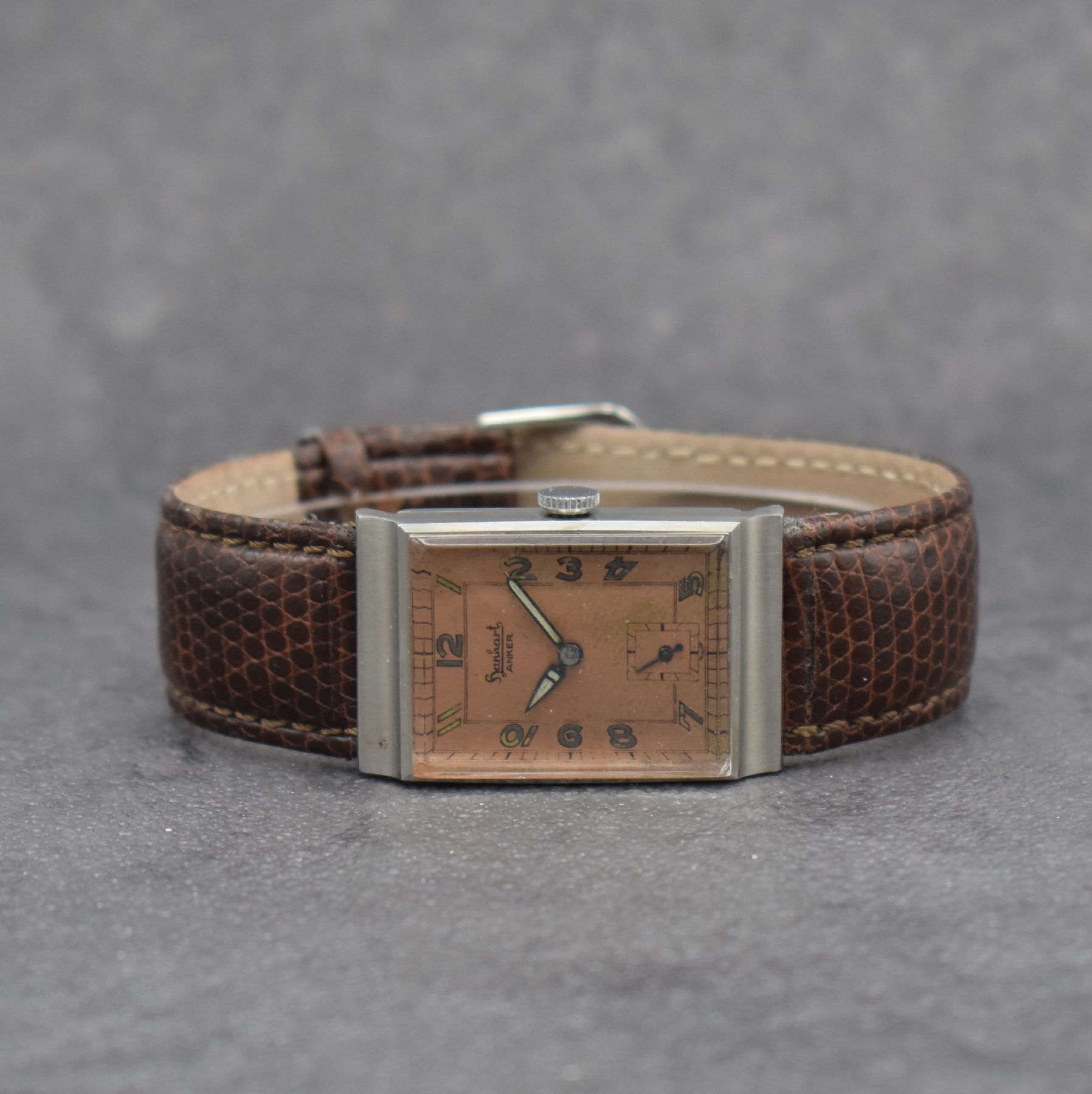 HANHART Anker Herrenarmbanduhr in Edelstahl, Deutschland um 1930, Handaufzug, 2-teil. Gehäuse, Boden aufgedr., kupferfarb. Zifferbl. m. arab. Zahlen ...