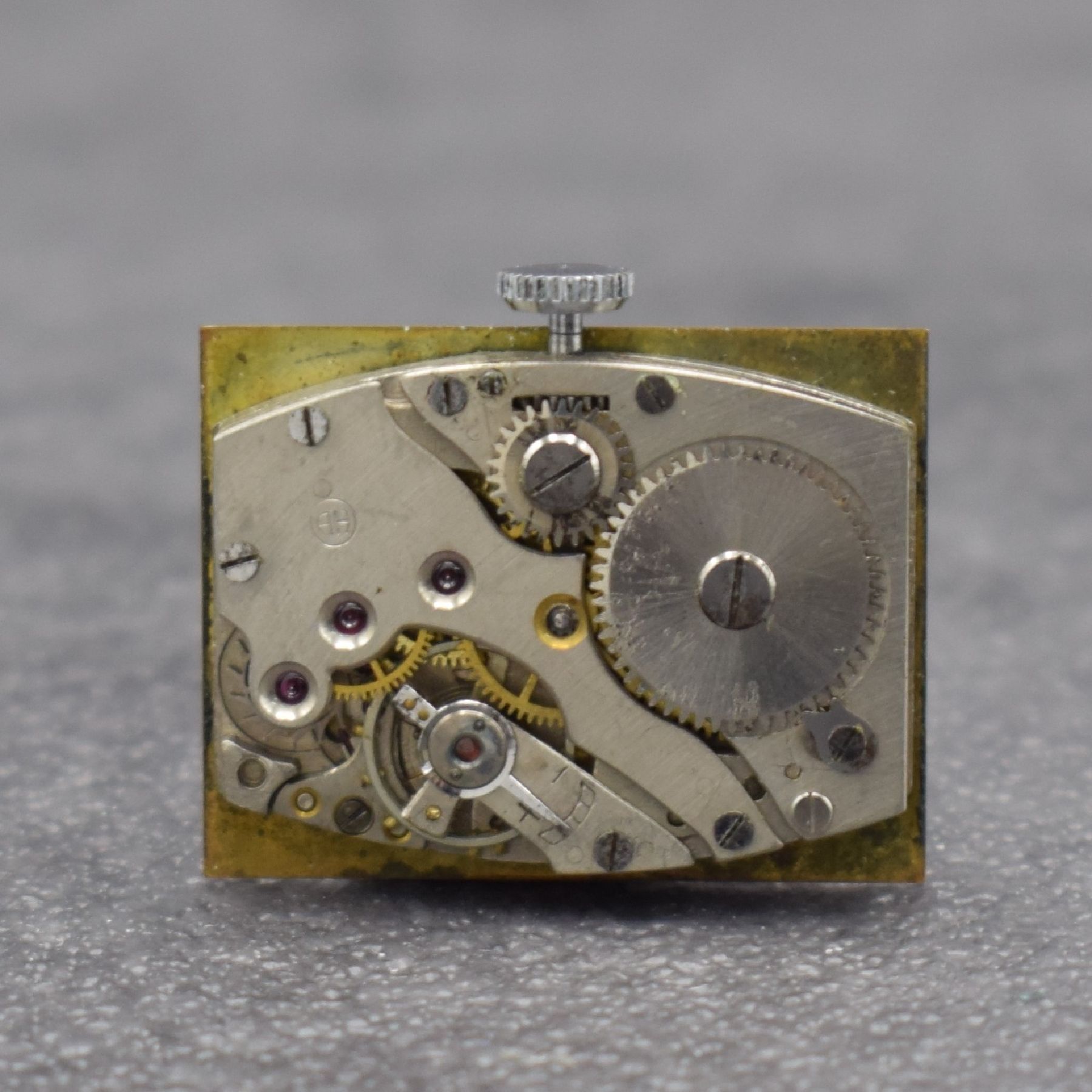 Detail e: HANHART Anker Herrenarmbanduhr in Edelstahl, Deutschland um 1930, Handaufzug, 2-teil. Gehäuse, Boden aufgedr., kupferfarb. Zifferbl. m. arab. Zahlen ...