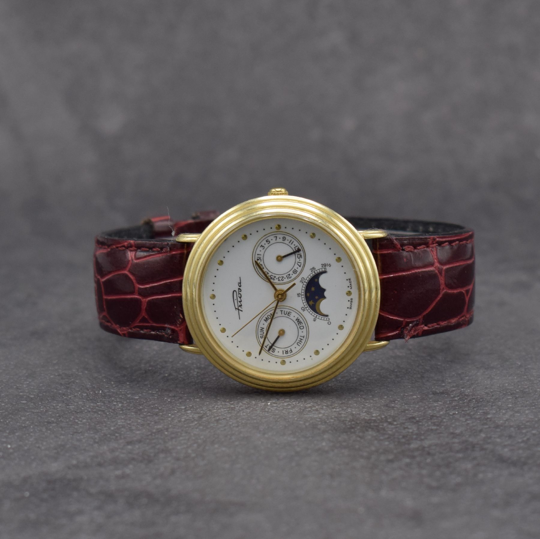 PRIOSA Armbanduhr in GG 585/000 mit Mondphase, Schweiz um 1990, quarz, Boden aufgedr., weißes Zifferbl. m. gold. Indizes & Zeigern, Tag & Datum, D. ...