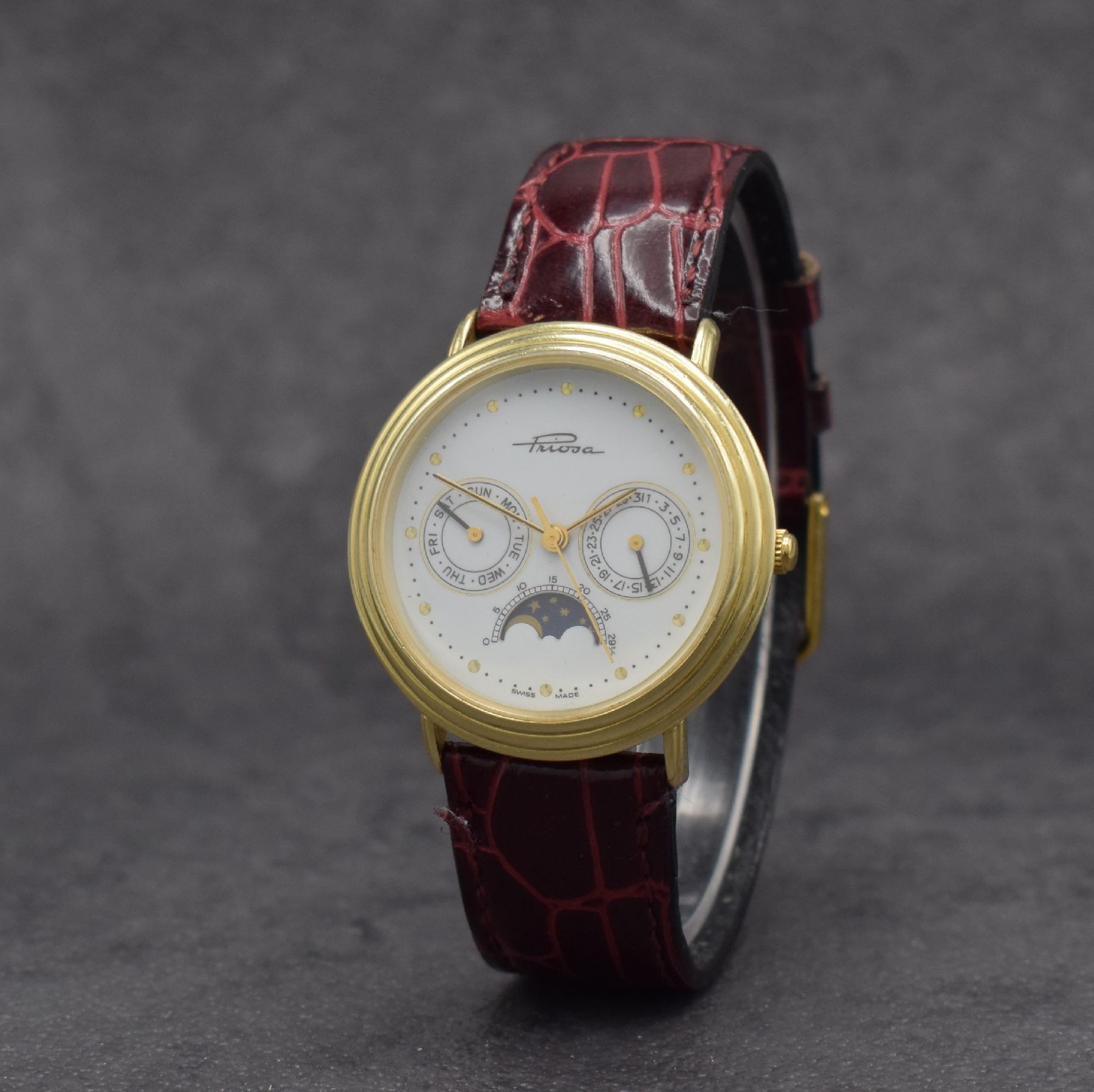 Detail b: PRIOSA Armbanduhr in GG 585/000 mit Mondphase, Schweiz um 1990, quarz, Boden aufgedr., weißes Zifferbl. m. gold. Indizes & Zeigern, Tag & Datum, D. ...