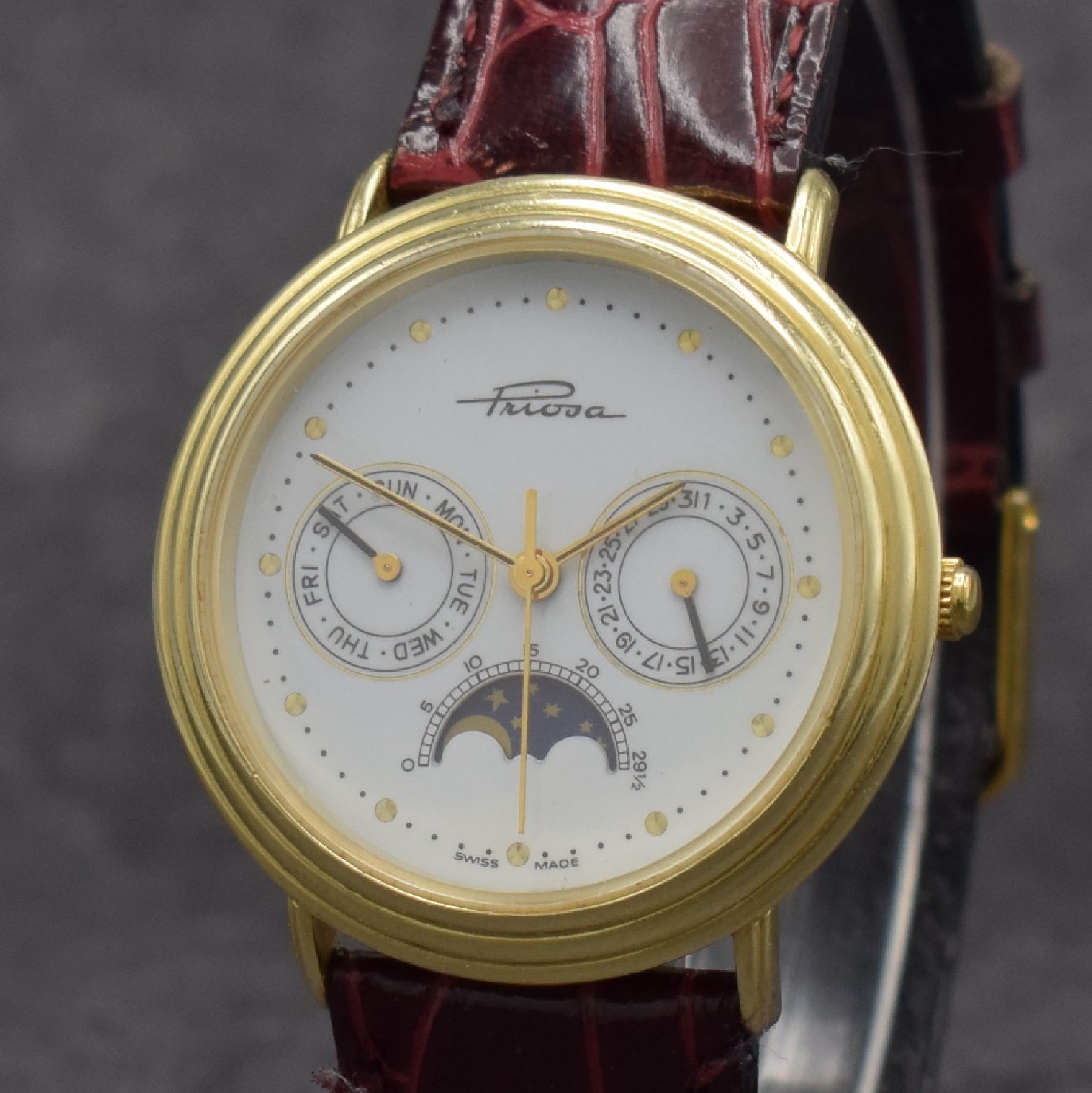 Detail c: PRIOSA Armbanduhr in GG 585/000 mit Mondphase, Schweiz um 1990, quarz, Boden aufgedr., weißes Zifferbl. m. gold. Indizes & Zeigern, Tag & Datum, D. ...