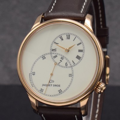 26256963a - JAQUET DROZ 18k pink gold gents wristwatch Grande Seconde Off Center, self winding, leather strap with original 18k pink gold buckle, on both sides glazed, snap on case back, ivory coloured enamel dial with decentralized hours, minutes & big second, winding crown at 4, diameter approx. 43 mm, condition 2