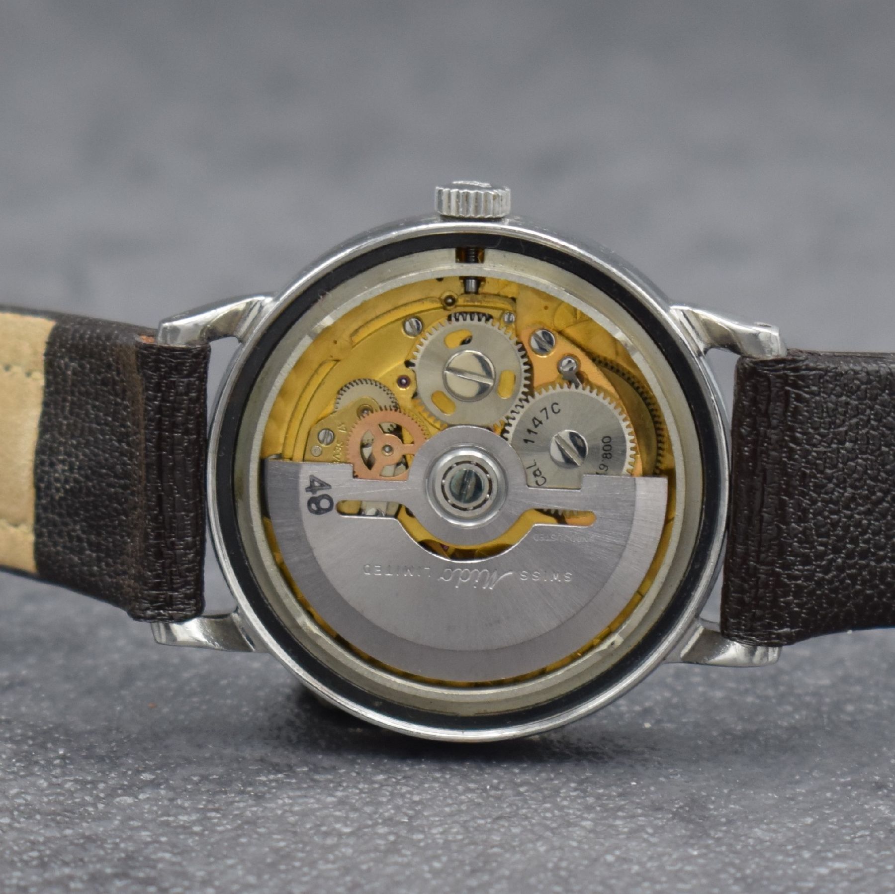 Detail f: MIDO Multifort Herrenarmbanduhr in Stahl, Schweiz um 1965, Automatik, Boden geschr., silb. Zifferbl. m. aufges. Std.-Ind., silb. Zeiger, Datum, verg. ...