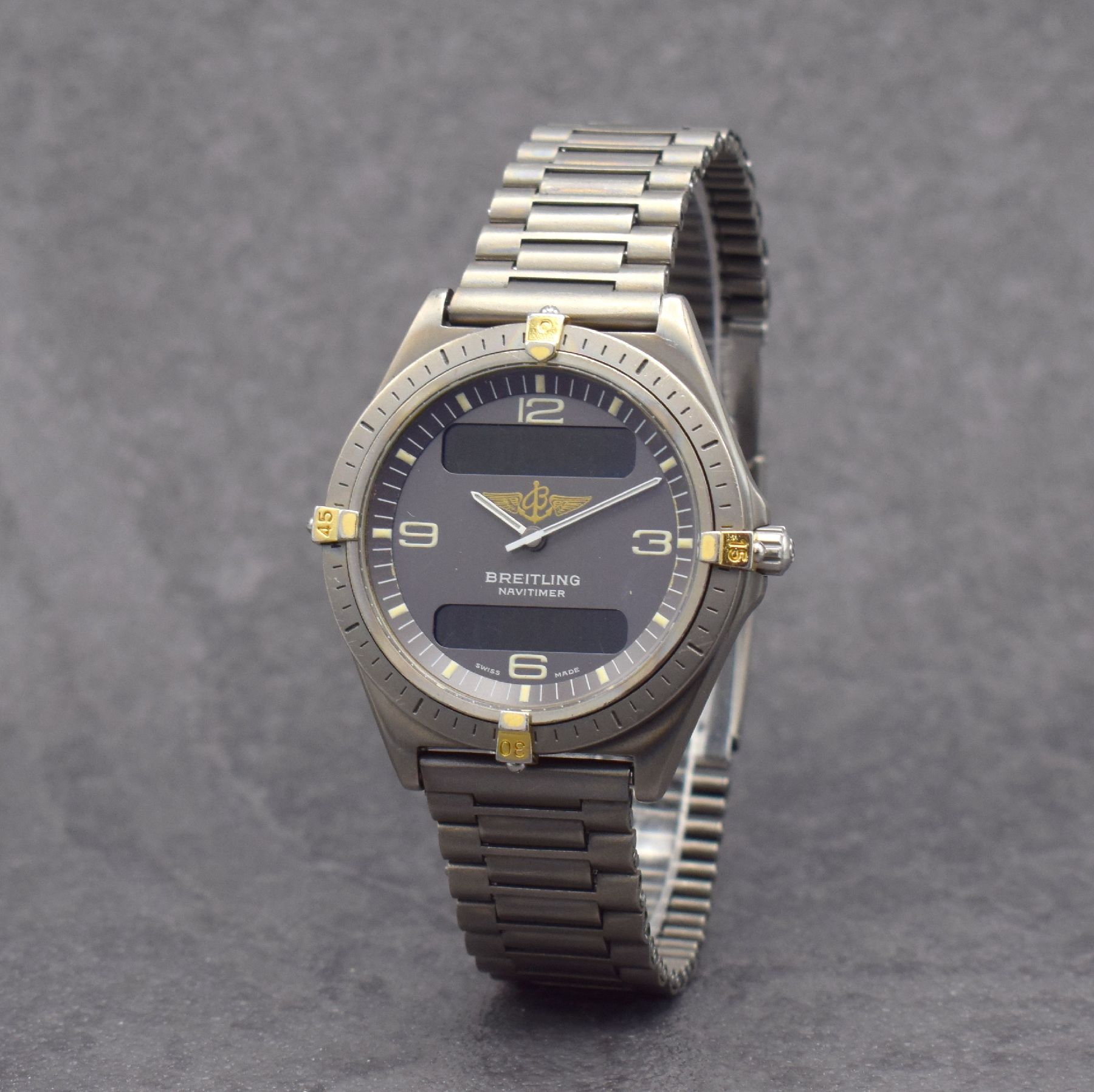 Detail b: BREITLING Herrenarmbanduhr Navitimer Aerospace mit Multifunktionsanzeige, Schweiz um 1995, Ref. 80360, Titangeh. inkl. Gliederband m. Faltschl., ...