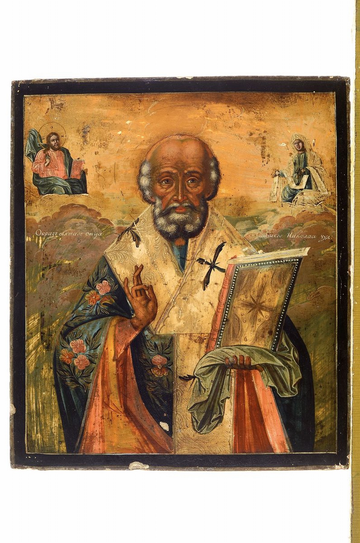 Detail k: Ikone, Russland, 2. Hälfte 19. Jh., Hl. Nikolaus, Tempera auf Holz, oben mit zwei Heiligen, leichte Alters- und Gebr.-spuren, ca. 31x27cm
