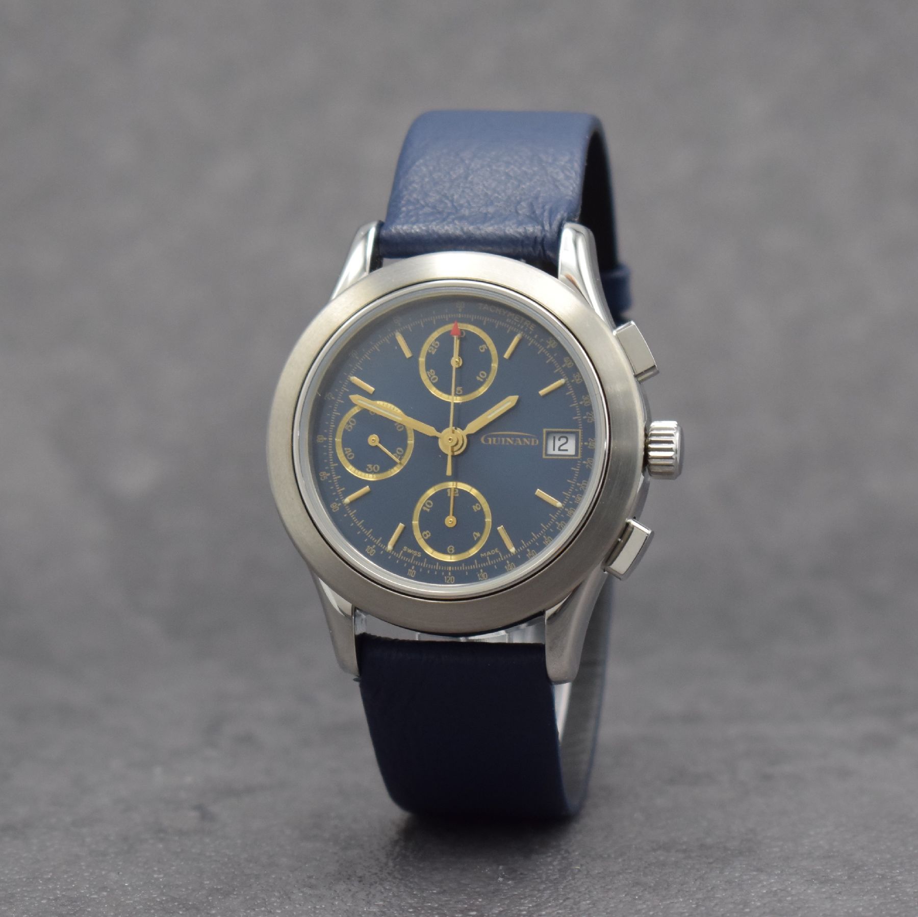Detail b: GUINAND nahezu neuwertige Herrenarmbanduhr mit Chronograph, Schweiz um 2000, Automatik, verschr. Geh. in Edelstahl, blaues Zifferbl. m. aufges. gold. ...