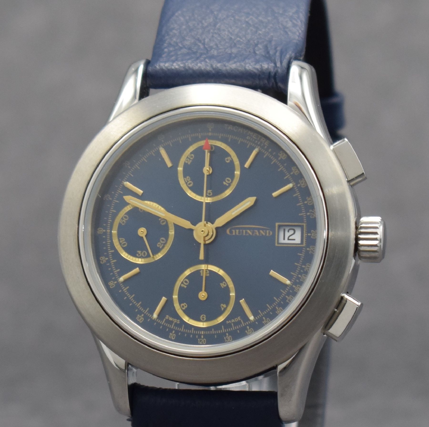 Detail c: GUINAND nahezu neuwertige Herrenarmbanduhr mit Chronograph, Schweiz um 2000, Automatik, verschr. Geh. in Edelstahl, blaues Zifferbl. m. aufges. gold. ...