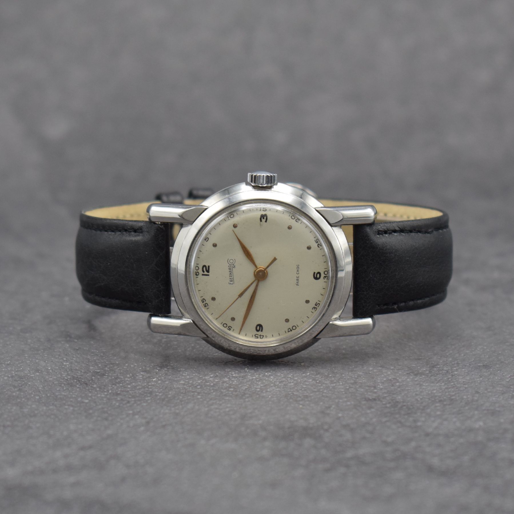 EBERHARD & Co. Armbanduhr, Handaufzug, Schweiz um 1950, 3-teil. Edelstahlgeh., Boden verschr., Glasrand aufgedr., silb. Zifferbl. altersbed. get., ...