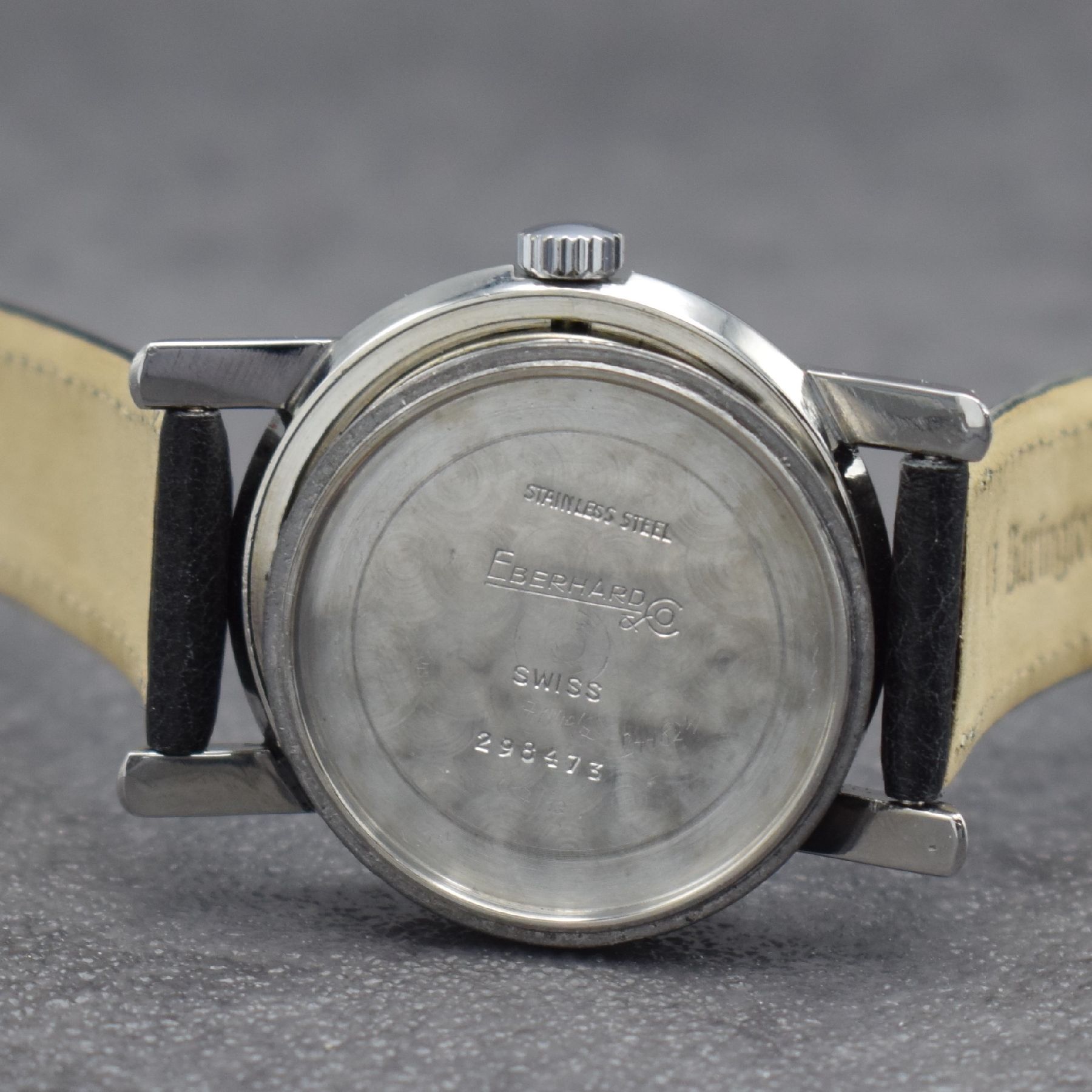 Detail f: EBERHARD & Co. Armbanduhr, Handaufzug, Schweiz um 1950, 3-teil. Edelstahlgeh., Boden verschr., Glasrand aufgedr., silb. Zifferbl. altersbed. get., ...