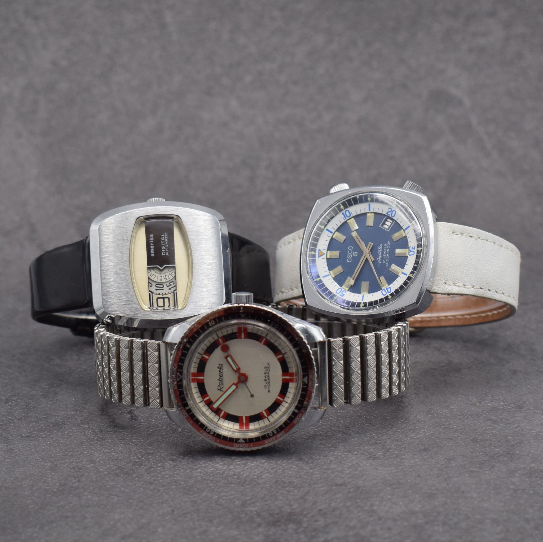 Konvolut 3 Armbanduhren, alle Schweiz/Deutschland um 1970, alle in verchr. Metallgeh. m. Edelstahlböden, 1 x America Digital, Automatik, digitale ...