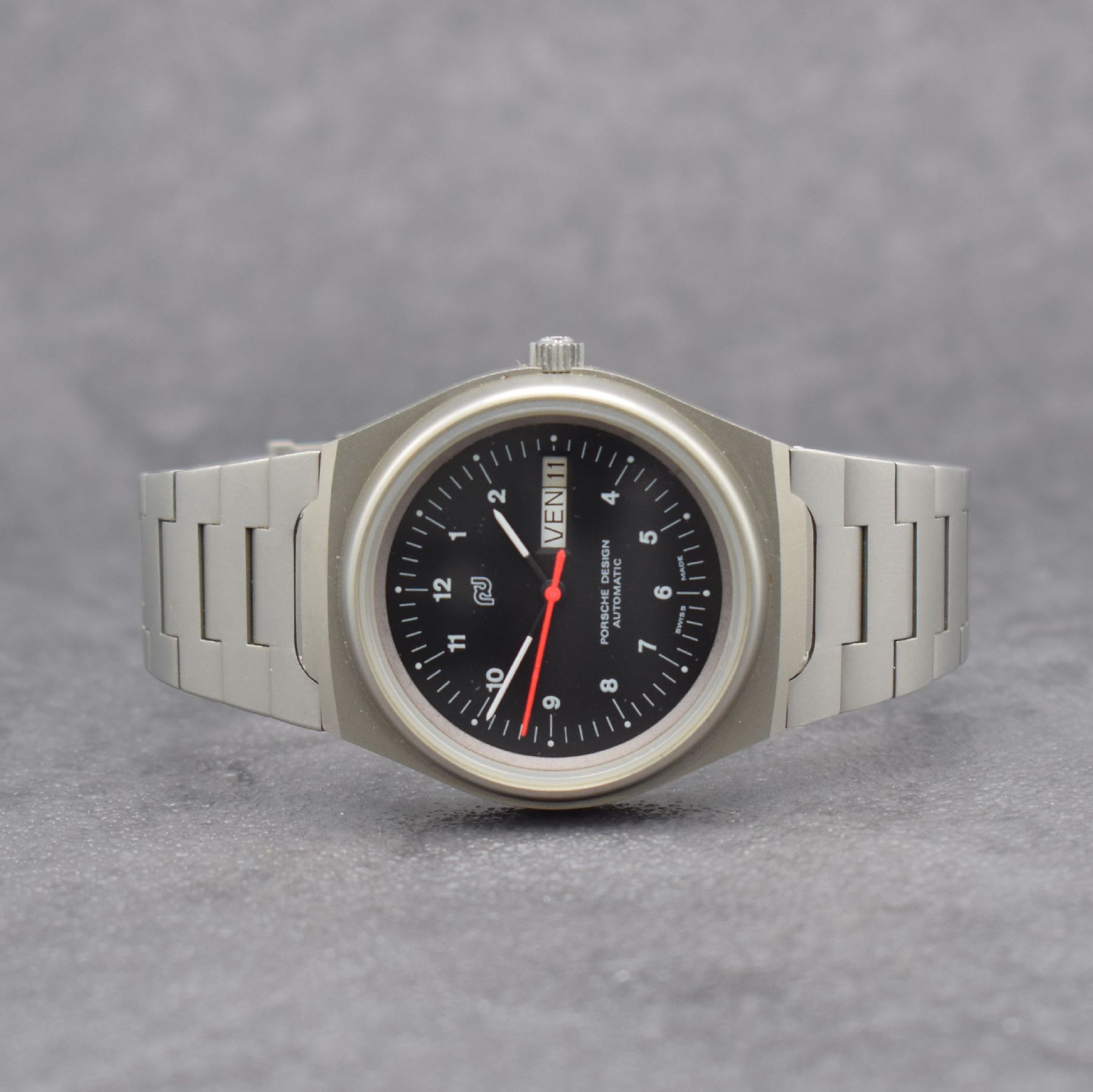 ORFINA / PORSCHE DESIGN Armbanduhr, Schweiz 1990er Jahre, Automatik, matt. Edelstahlgeh. inkl. Gliederband, Boden verschr., schwarzes Zifferbl. m. ...