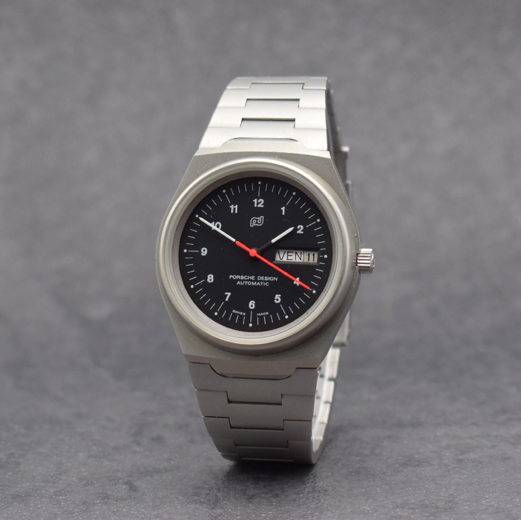Detail b: ORFINA / PORSCHE DESIGN Armbanduhr, Schweiz 1990er Jahre, Automatik, matt. Edelstahlgeh. inkl. Gliederband, Boden verschr., schwarzes Zifferbl. m. ...
