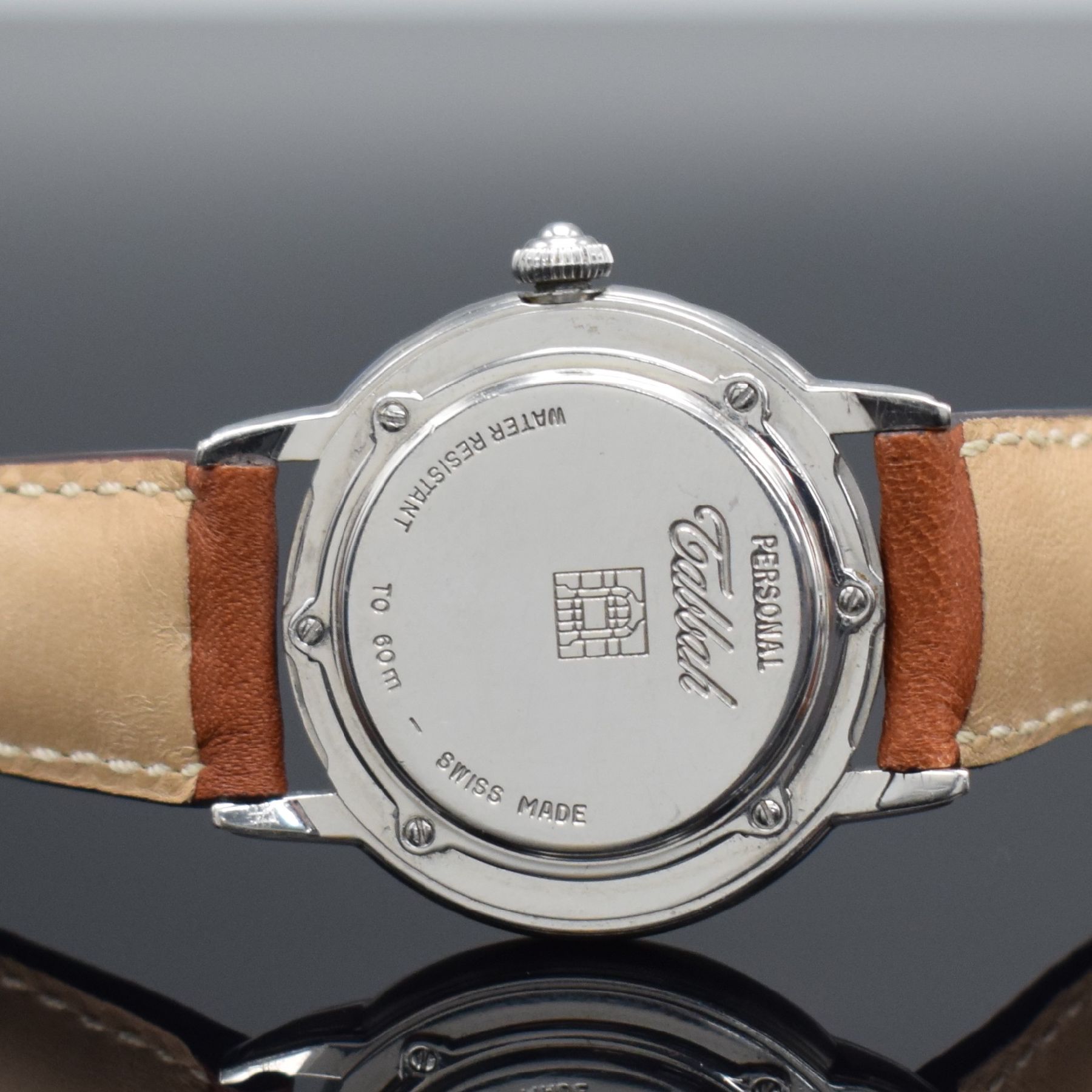 Detail d: TABBAH Armbanduhr Day-Date Serie Personal, Schweiz 1990er Jahre, quarz, Edelstahlgeh., Boden 6-fach verschr., emailfarb. Zifferbl. m. röm. Std., ...