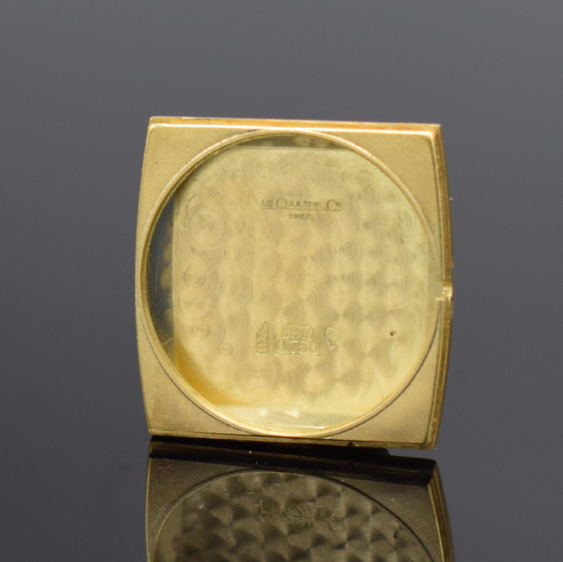 Detail g: Jaeger-LeCoultre Armbanduhr in GG 750/000, Schweiz um 1970, Handaufzug, rechteck. Geh. teils angel., Boden aufgedr., gold. Zifferbl. m. gold. aufges. ...