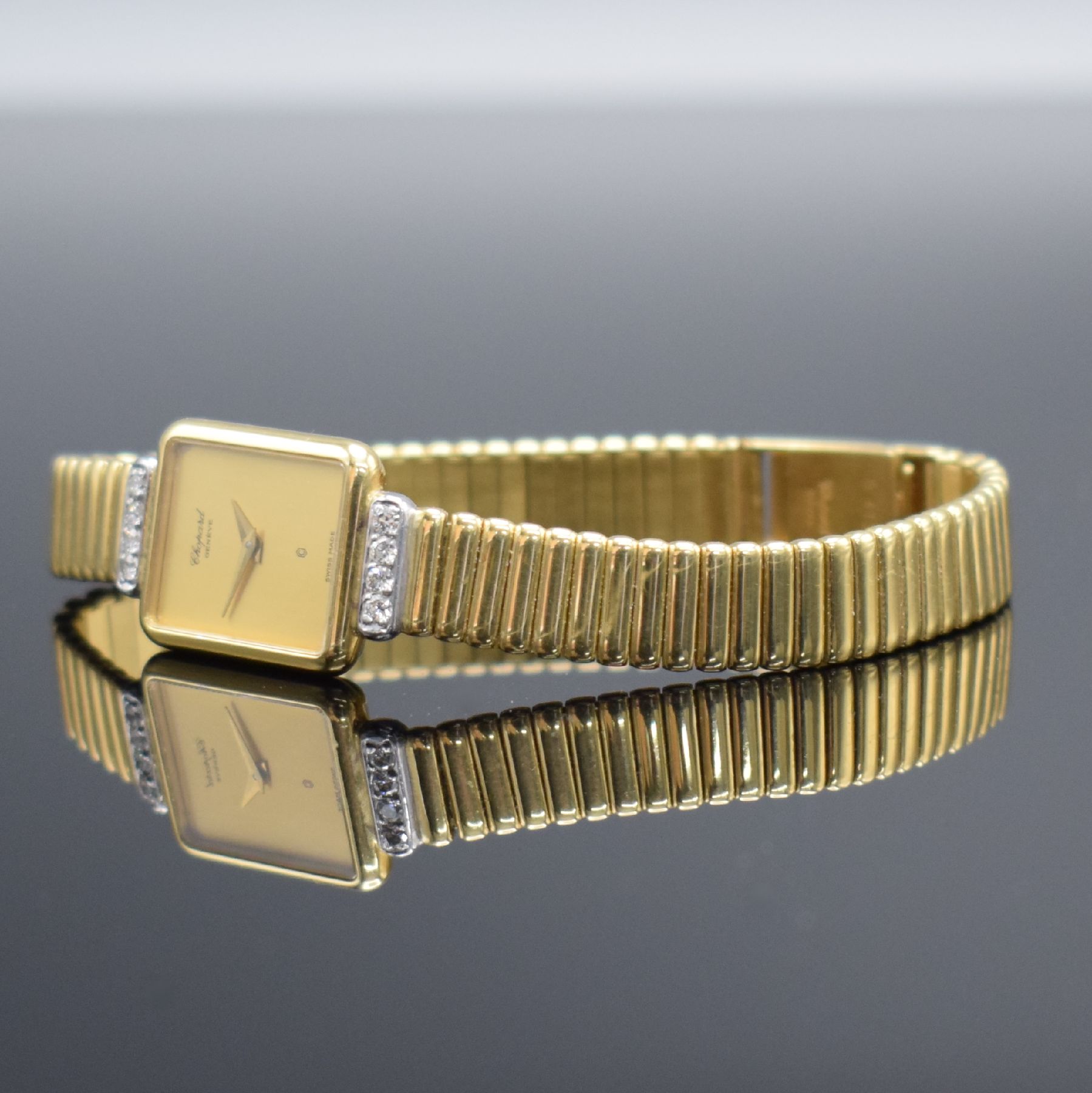 Detail d: CHOPARD diamantbesetzte Damenarmbanduhr in GG 750/000, Schweiz um 1985, quarz, rechteck. Geh., Boden aufgedr., Zeigerstellung über Drücker im ...