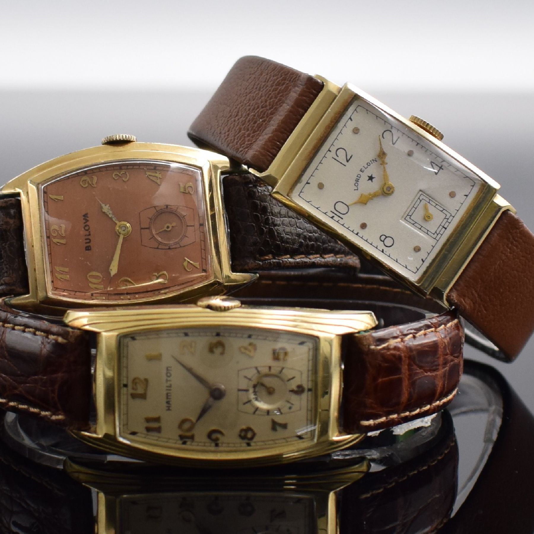 Detail a: LORD ELGIN, BULOVA, HAMILTON 3 Armbanduhren, USA um 1940, Handaufzug, 1.) Lord Elgin in GG 585/000, Kal. 559, M. ca. 27 x 20 mm, Überh. fäll., EZ ...