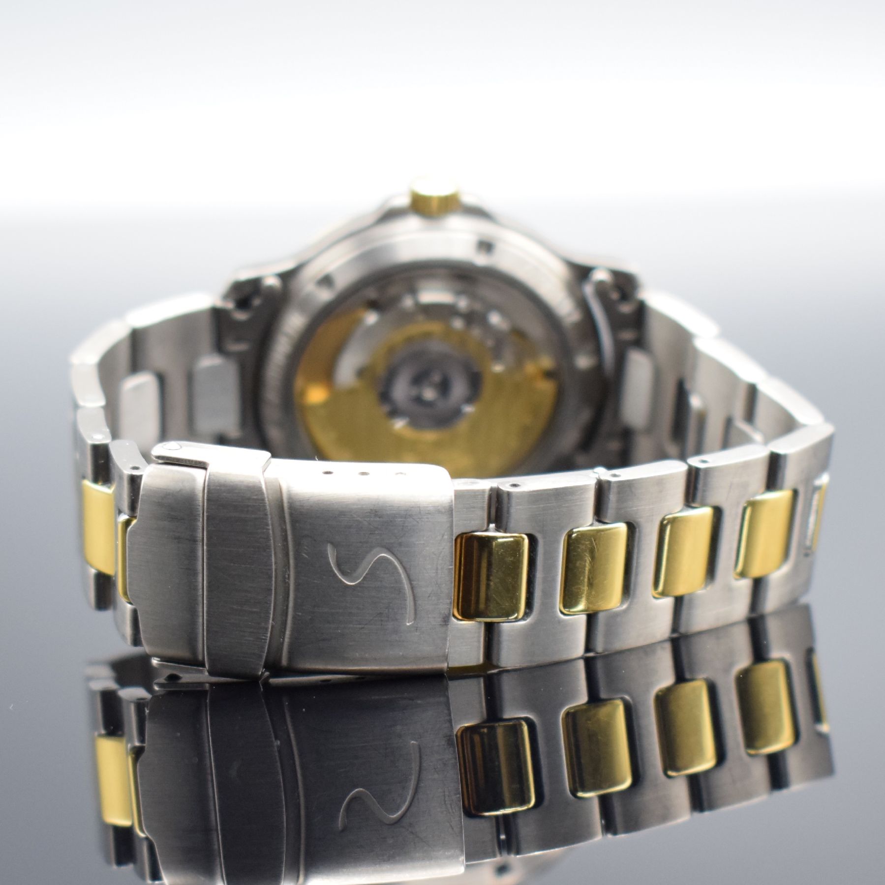 Detail f: SINN Chronometer Herrenarmbanduhr, Schweiz/ Deutschland um 1995, Automatik, Titan/Gold komb., Gliederband m. Faltschl., schwarzes Zifferbl. m. arab. ...