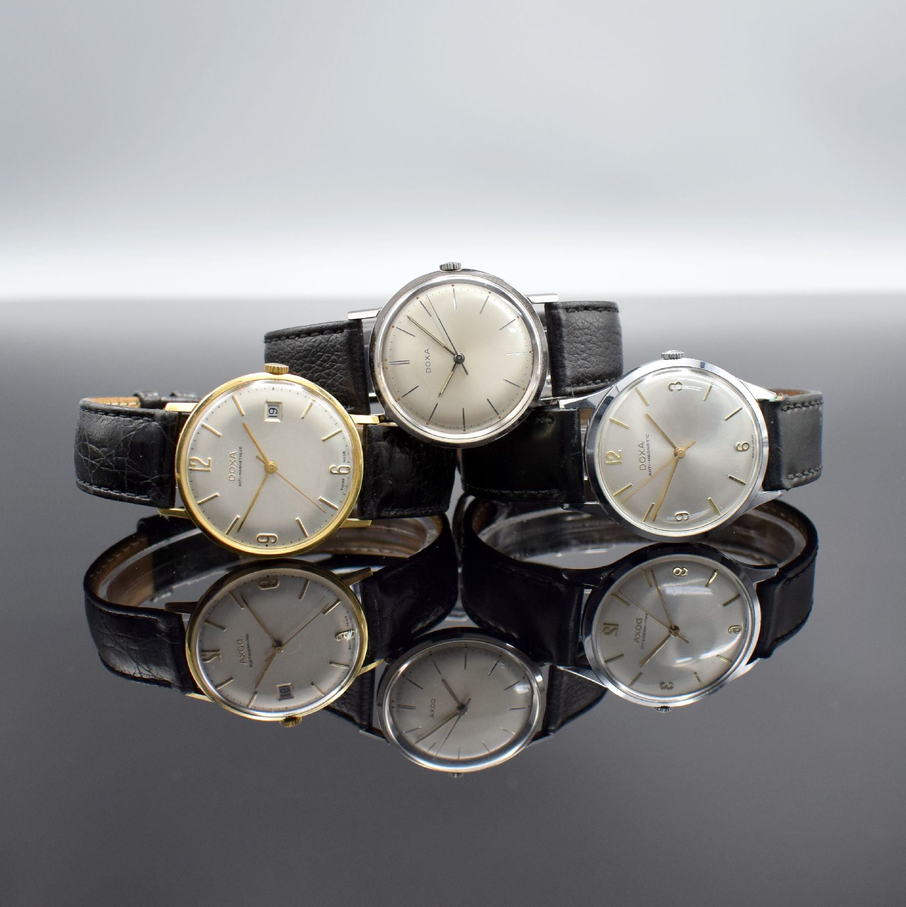 DOXA 3 Herrenarmbanduhren, Schweiz um 1960, Handaufzug, 1.) GG 585/000, Kal. 45, 17 St., Feinreg., D. ca. 34,5 mm, EZ 2-3, 2.) Edelstahl, Kal. 103, ...