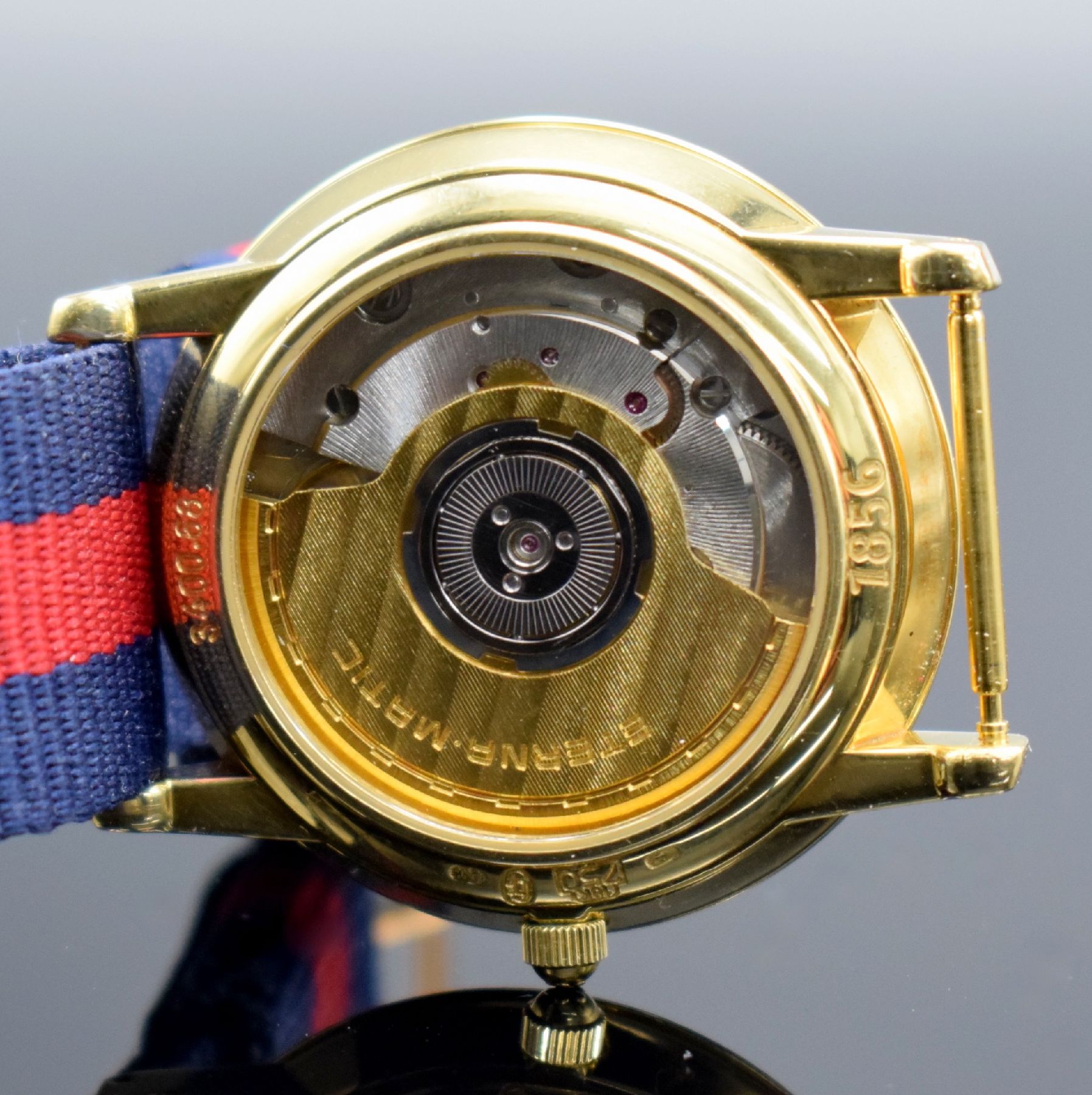 Detail h: ETERNA-MATIC Herrenarmbanduhr in GG 750/000, Schweiz um 2000, Automatik, beids. vergl. Gehäuse, Boden & Glasrand aufgedr., gold. Zifferbl. m. ...
