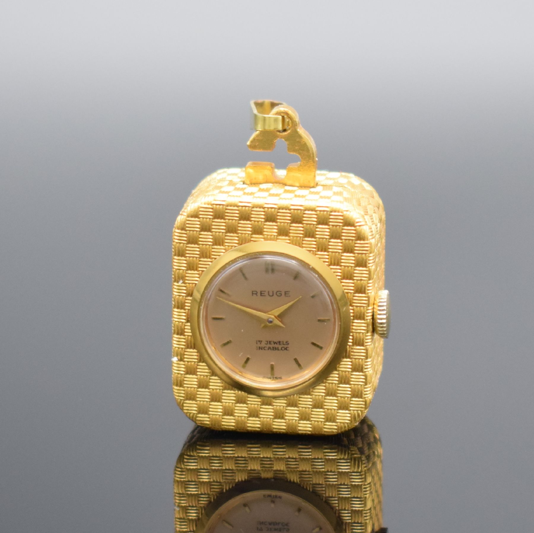 REUGE Miniatur Anhängeuhr mit Spielwerk, Schweiz um 1960, Handaufzug, verg. Geh. m. Web-Strucktur, gedr., vorderseitig einges. Uhr, verg. Zifferbl., ...