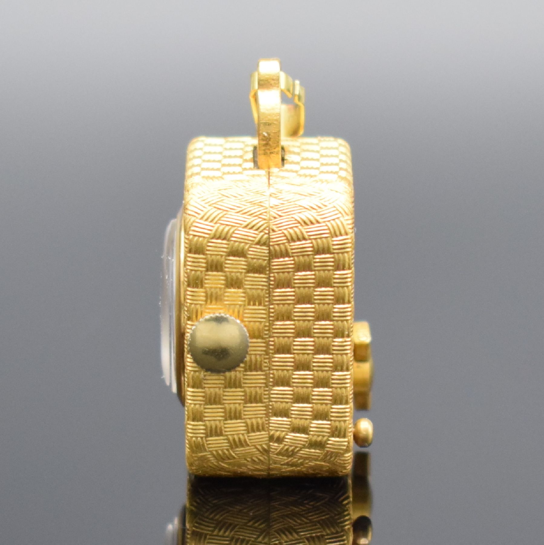 Detail b: REUGE Miniatur Anhängeuhr mit Spielwerk, Schweiz um 1960, Handaufzug, verg. Geh. m. Web-Strucktur, gedr., vorderseitig einges. Uhr, verg. Zifferbl., ...