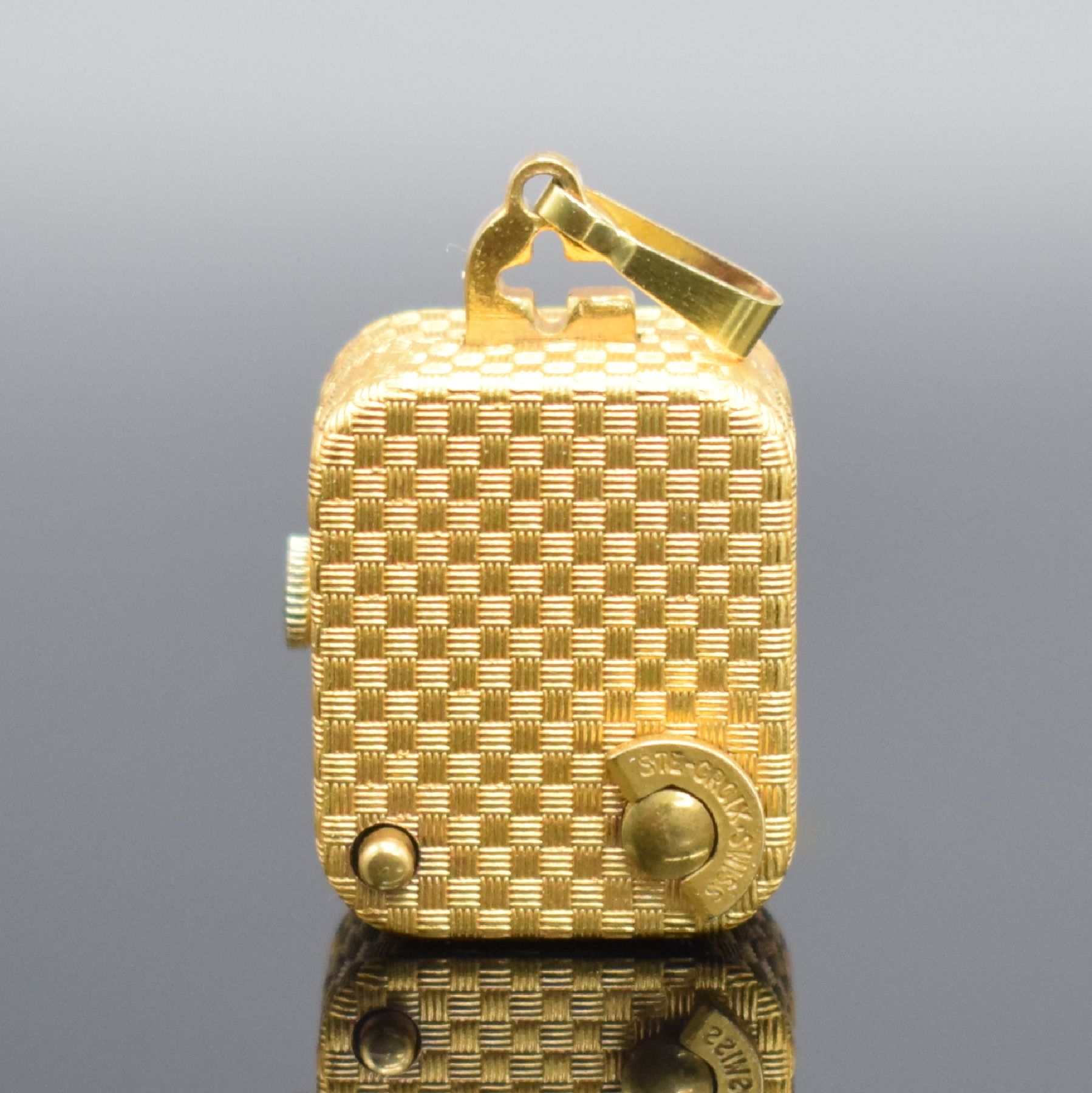 Detail c: REUGE Miniatur Anhängeuhr mit Spielwerk, Schweiz um 1960, Handaufzug, verg. Geh. m. Web-Strucktur, gedr., vorderseitig einges. Uhr, verg. Zifferbl., ...