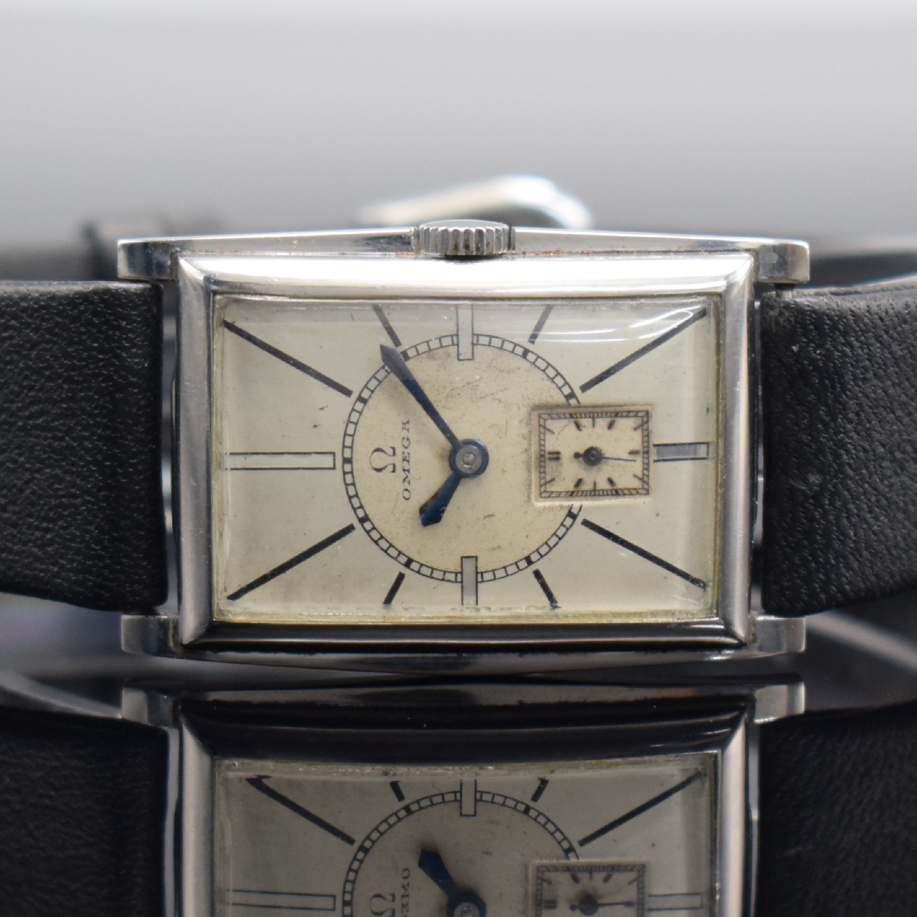 Detail a: OMEGA schöne rechteckige Armbanduhr in Stahl, Schweiz um 1935, Handaufzug, Boden aufgedr., silb. Duoton-Zifferbl. pat., gebl. orig. Zeiger, kl. ...