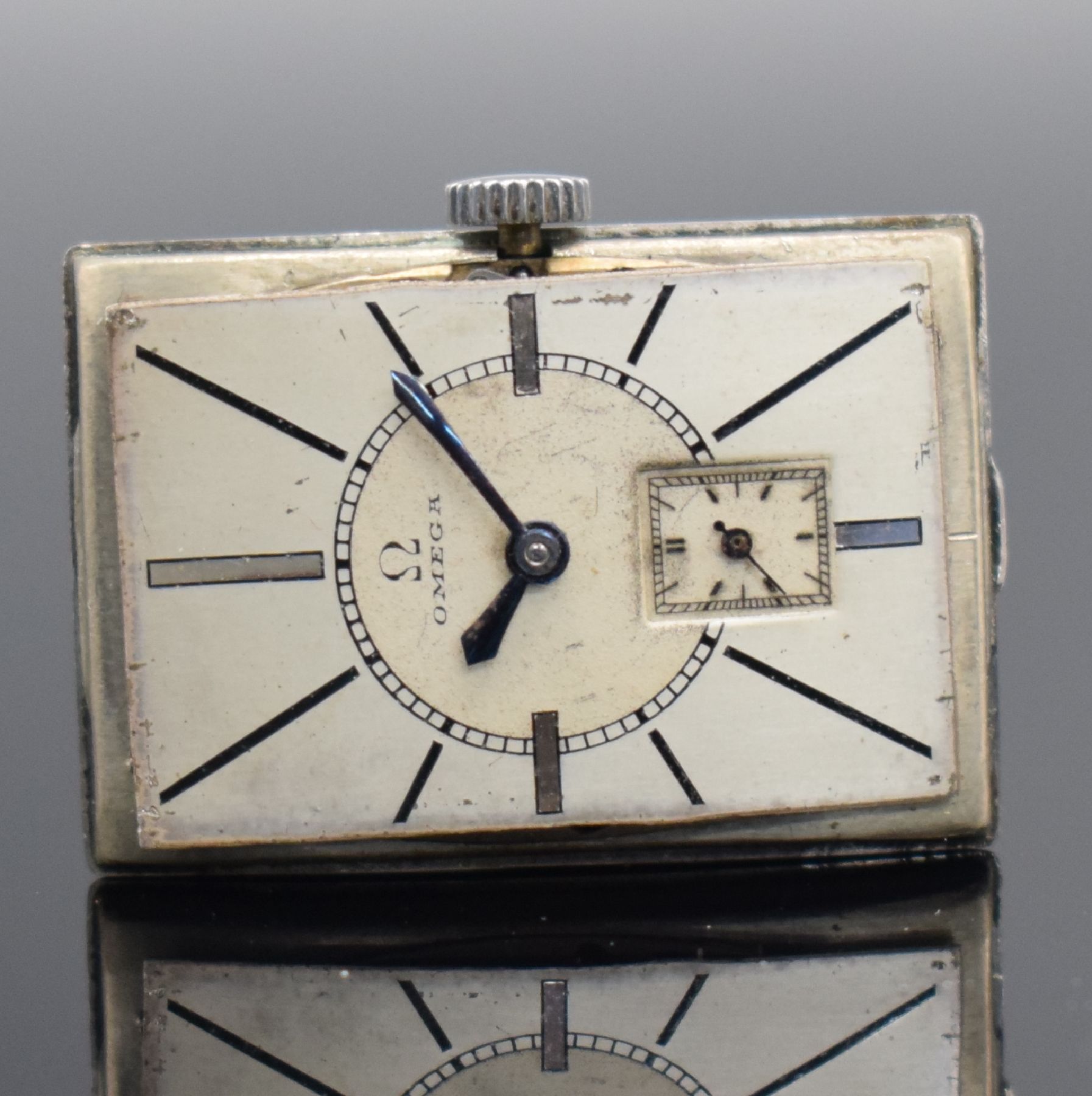 Detail f: OMEGA schöne rechteckige Armbanduhr in Stahl, Schweiz um 1935, Handaufzug, Boden aufgedr., silb. Duoton-Zifferbl. pat., gebl. orig. Zeiger, kl. ...