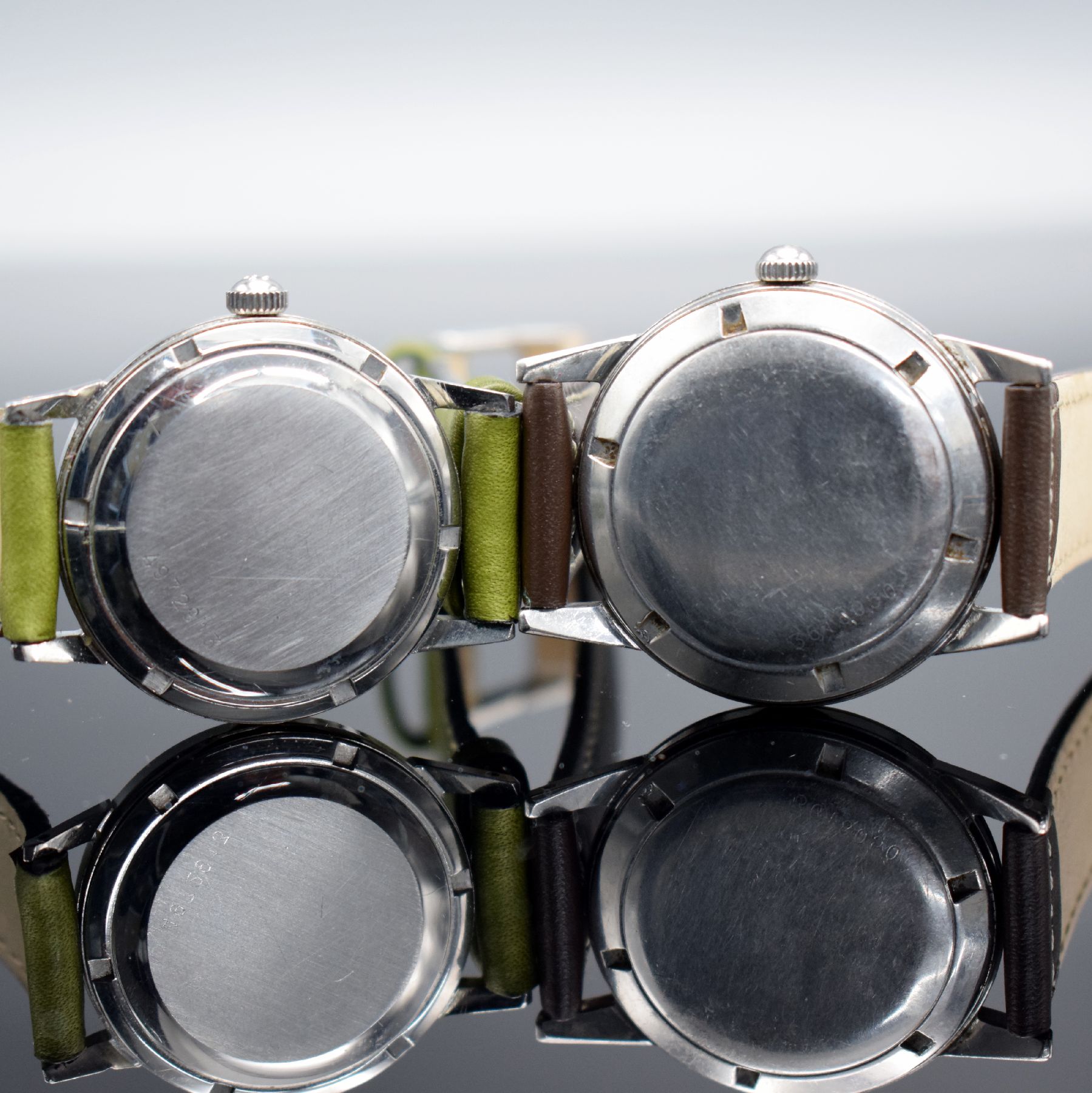 Detail e: ETERNA-MATIC 2 Armbanduhren mit schwarzem Zifferblatt in Stahl, Schweiz um 1950/1960, Automatik, verschr. Geh., orig. Kronen, Zifferblätter m. silb. ...