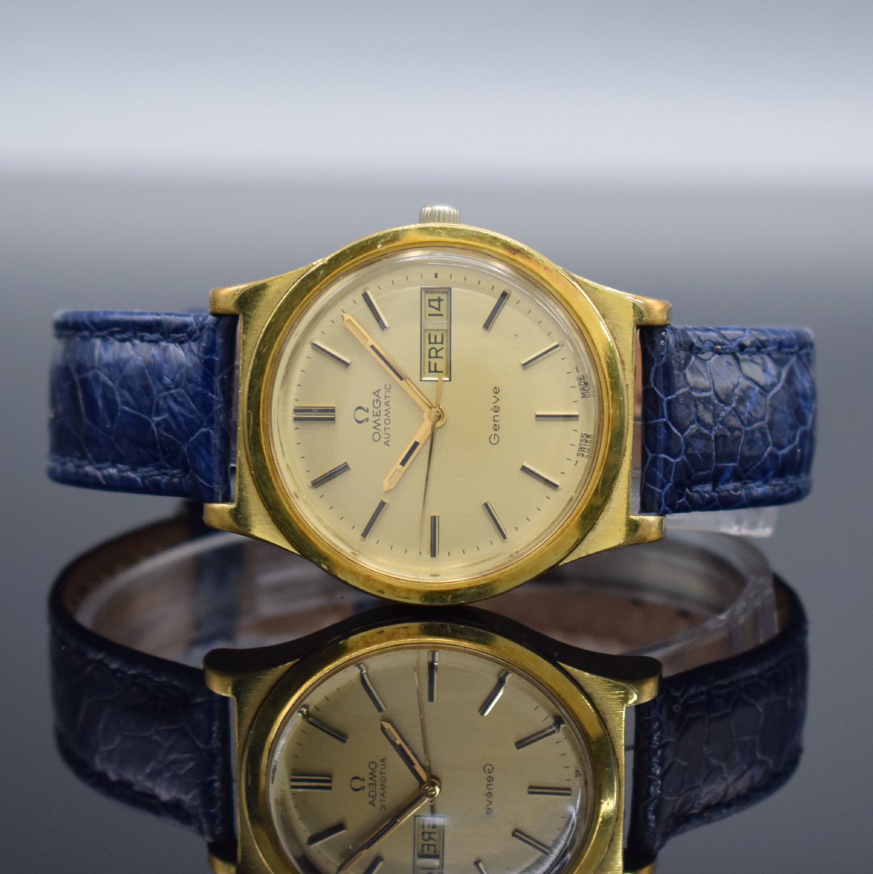 OMEGA Geneve Herrenarmbanduhr mit Tag & Datum, Schweiz um 1972, Automatik, Ref. 166 0169, verg. Geh., Stahlboden geschr., gold. Zifferbl. m. aufges. ...