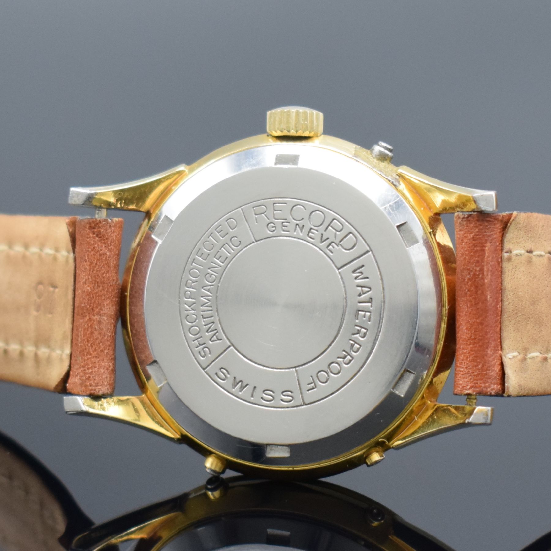 Detail d: RECORD WATCH CO vergoldete Herrenarmbanduhr mit Vollkalender & Mondphase, Schweiz um 1950, Handaufzug, verschr. Boden, silb. Zifferbl. m. gold. Ind. ...
