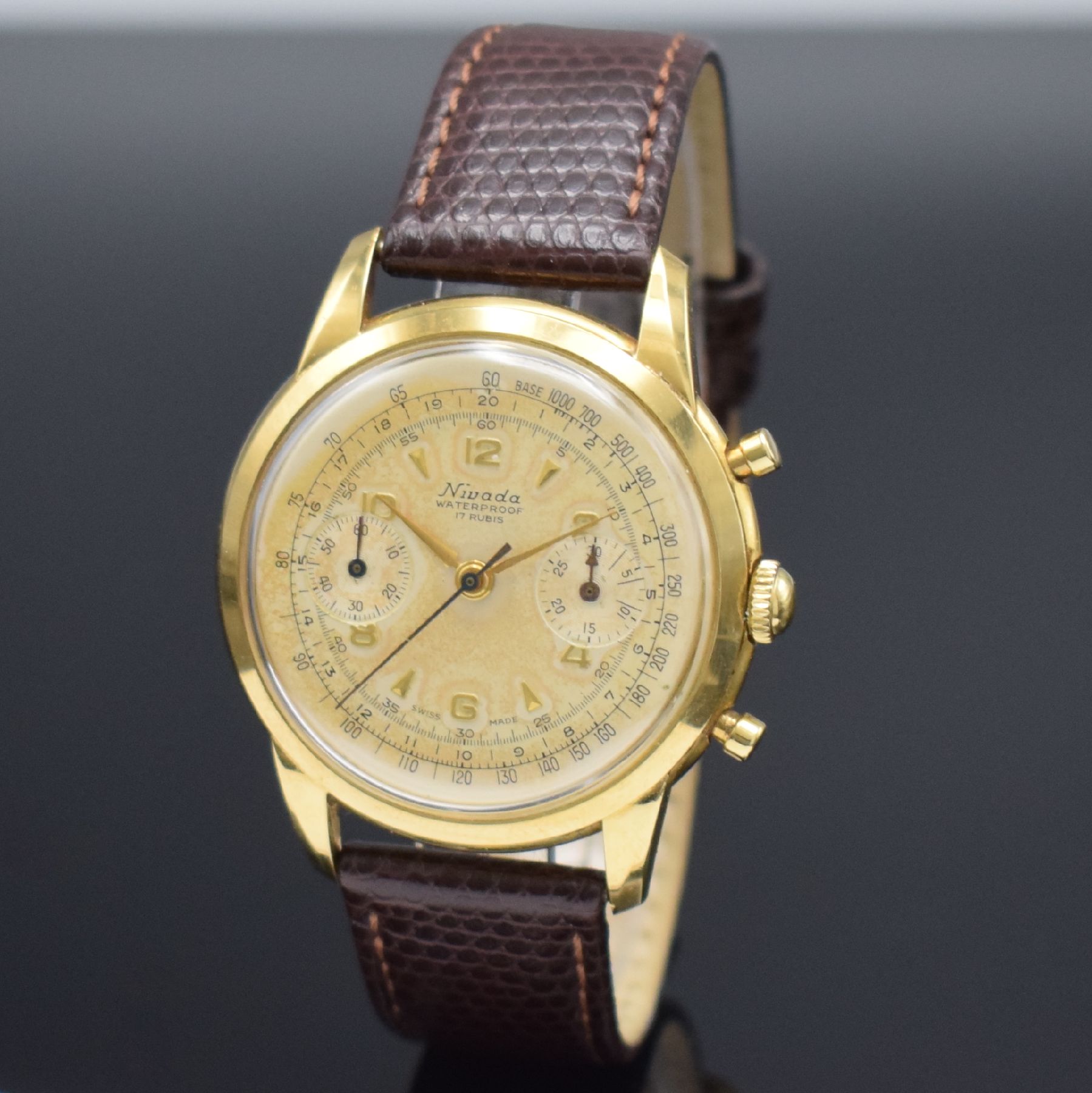 Detail b: NIVADA Schaltradchronograph in GG 750/000, Schweiz um 1950, Handaufzug, 2-tlg. Geh., Boden aufgedr., silb. Zifferbl. pat., gold. Ind. & Zahlen, orig. ...