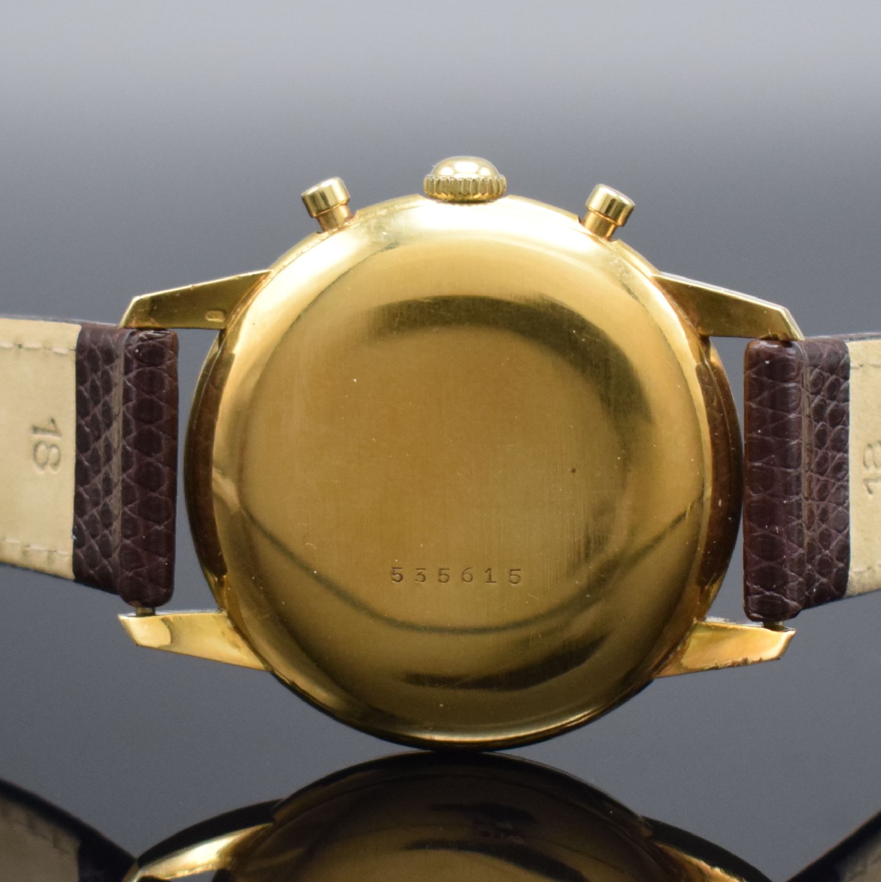 Detail d: NIVADA Schaltradchronograph in GG 750/000, Schweiz um 1950, Handaufzug, 2-tlg. Geh., Boden aufgedr., silb. Zifferbl. pat., gold. Ind. & Zahlen, orig. ...