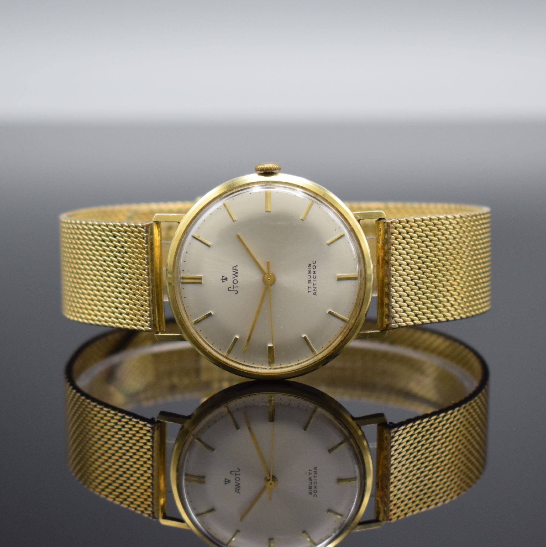 STOWA Herrenarmbanduhr in GG 585/000, Deutschland um 1965, Handaufzug, Boden aufgedr., verg. Band, vers. Zifferbl. m. gold. Ind. & Zeigern, Kal. PUW ...