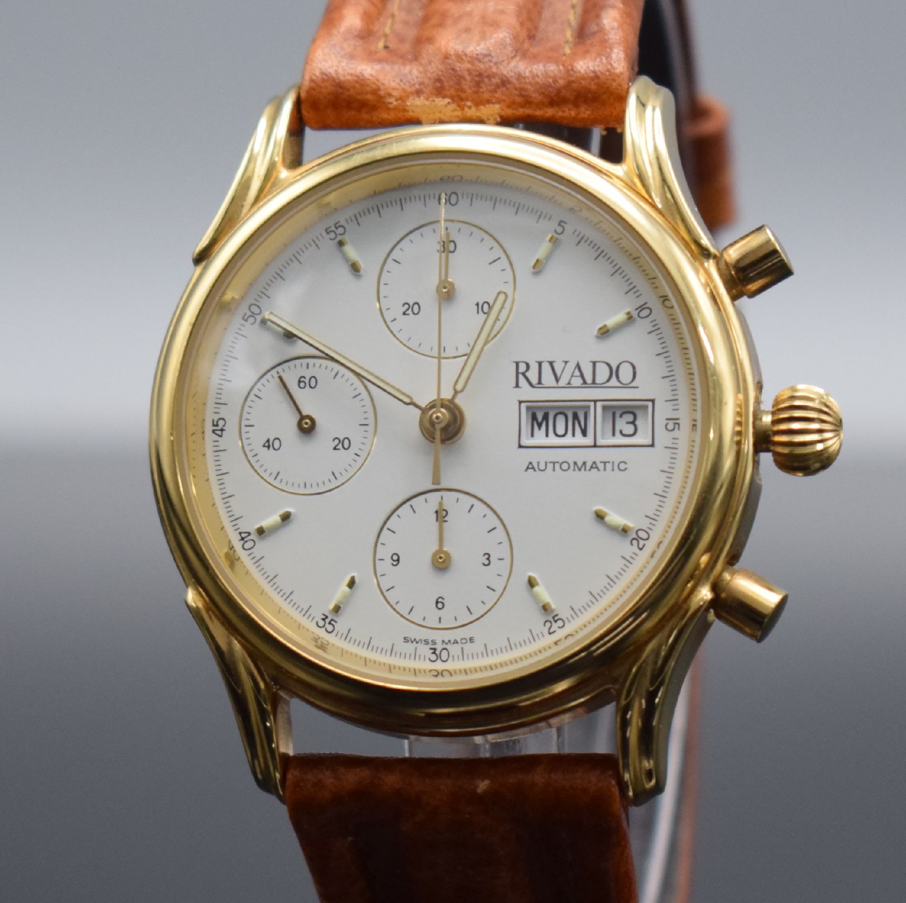 Detail c: RIVADO Herrenchronograph, Schweiz um 1995, Automatik, verg. Geh. m. verschr. Stahlboden, creme-farb. Zifferbl., gold. Indizes & Zeiger, Tag & Datum ...