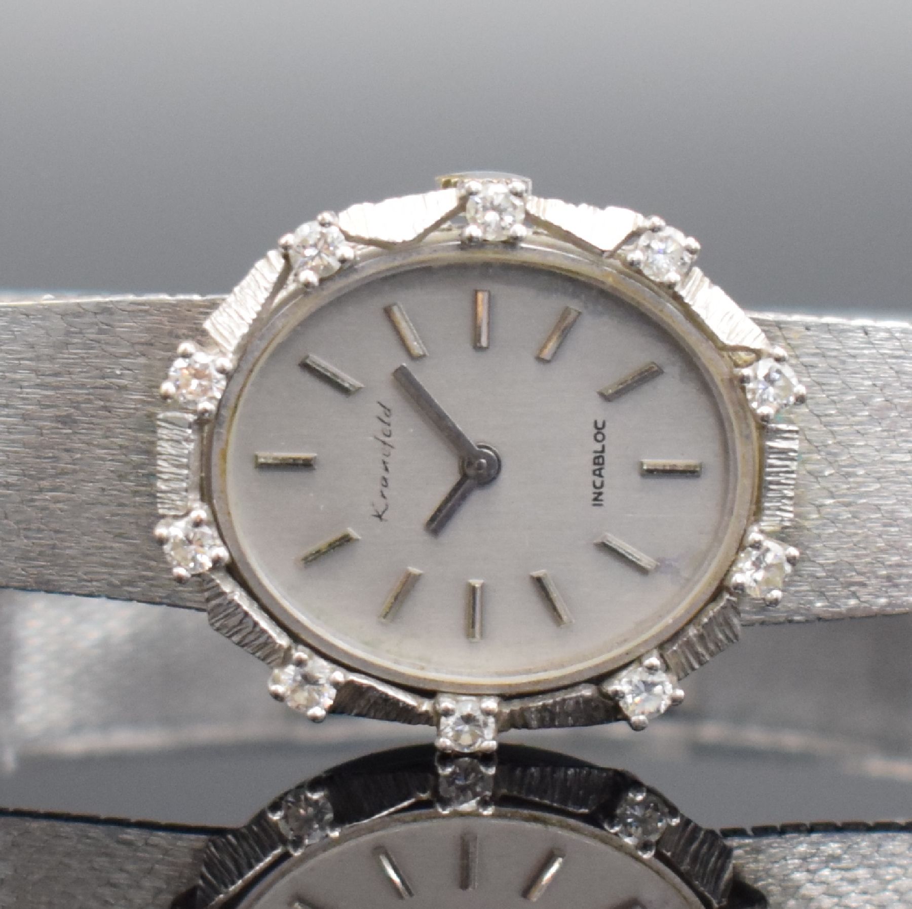 Detail a: KRANEFELD Damenarmbanduhr mit Diamantbesatz in WG 585/000, Schweiz um 1970, Handaufzug, Geh. an WG 585/000 Band, Boden aufgedr., silb. Zifferbl. m. ...