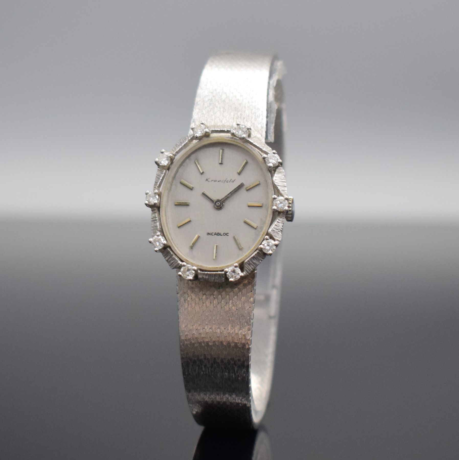 Detail b: KRANEFELD Damenarmbanduhr mit Diamantbesatz in WG 585/000, Schweiz um 1970, Handaufzug, Geh. an WG 585/000 Band, Boden aufgedr., silb. Zifferbl. m. ...