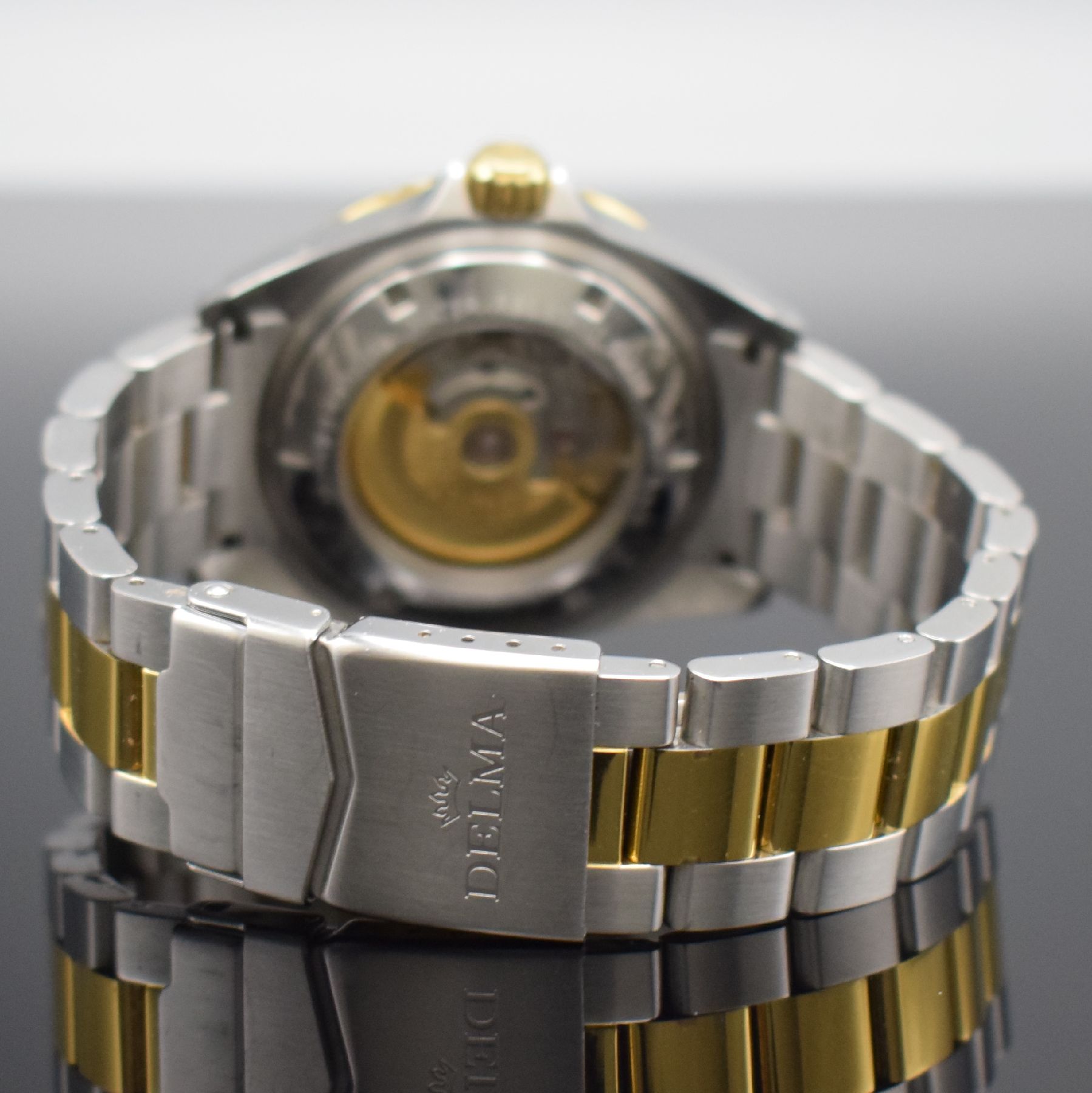 Detail d: DELMA Herrenarmbanduhr Santiago Bicolor Ceramic, Automatik, Schweiz um 2018, z. T. verg. Edelstahlgeh. inkl. Gliederband, beids. vergl., Boden & ...