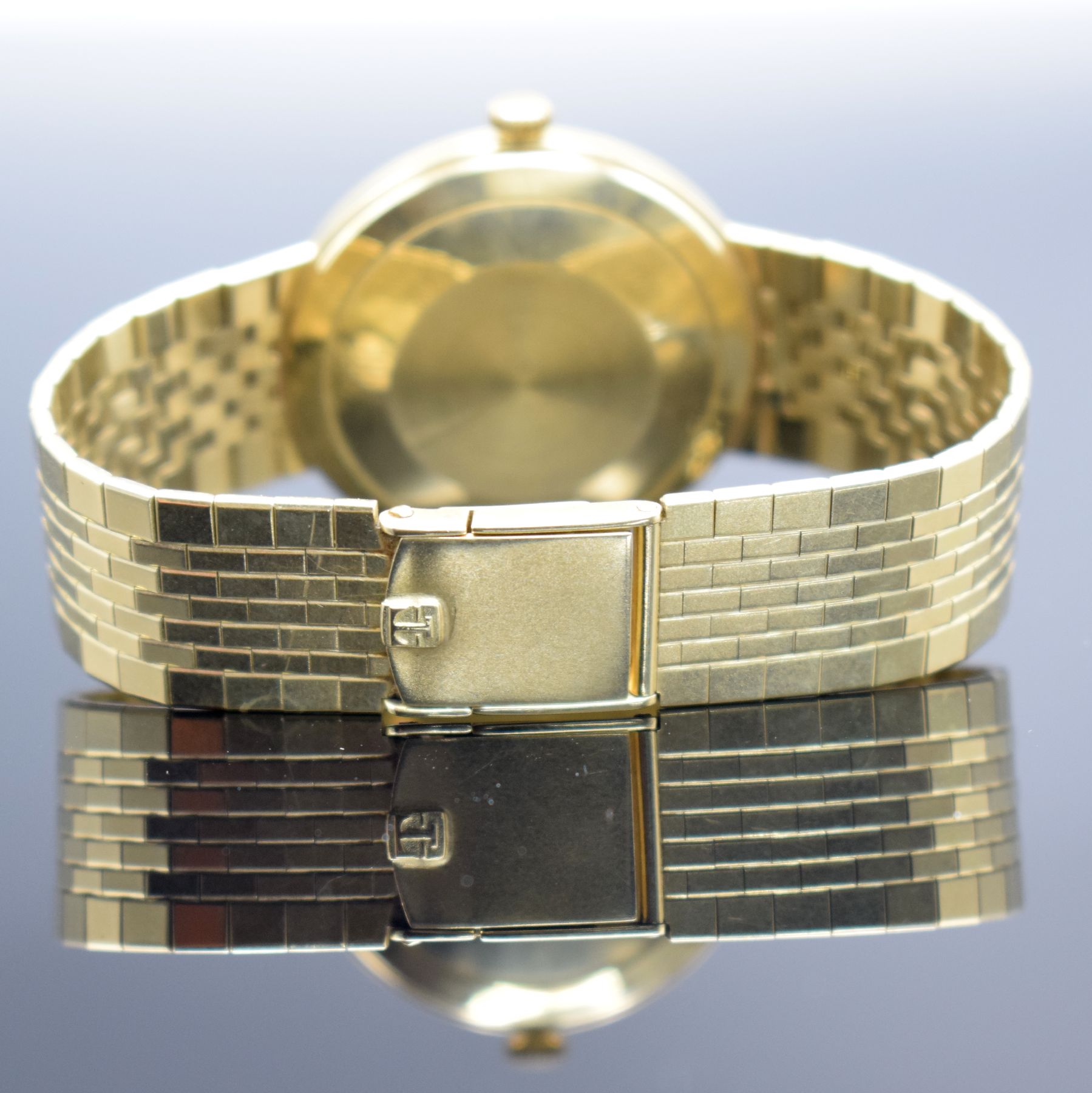 Detail f: TISSOT Herrenarmbanduhr in GG 585/000, Schweiz um 1965, Automatik, 2-teil. Geh., Boden aufgedr., orig. GG 585/000 Band, silb. Zifferbl. m. aufges. ...