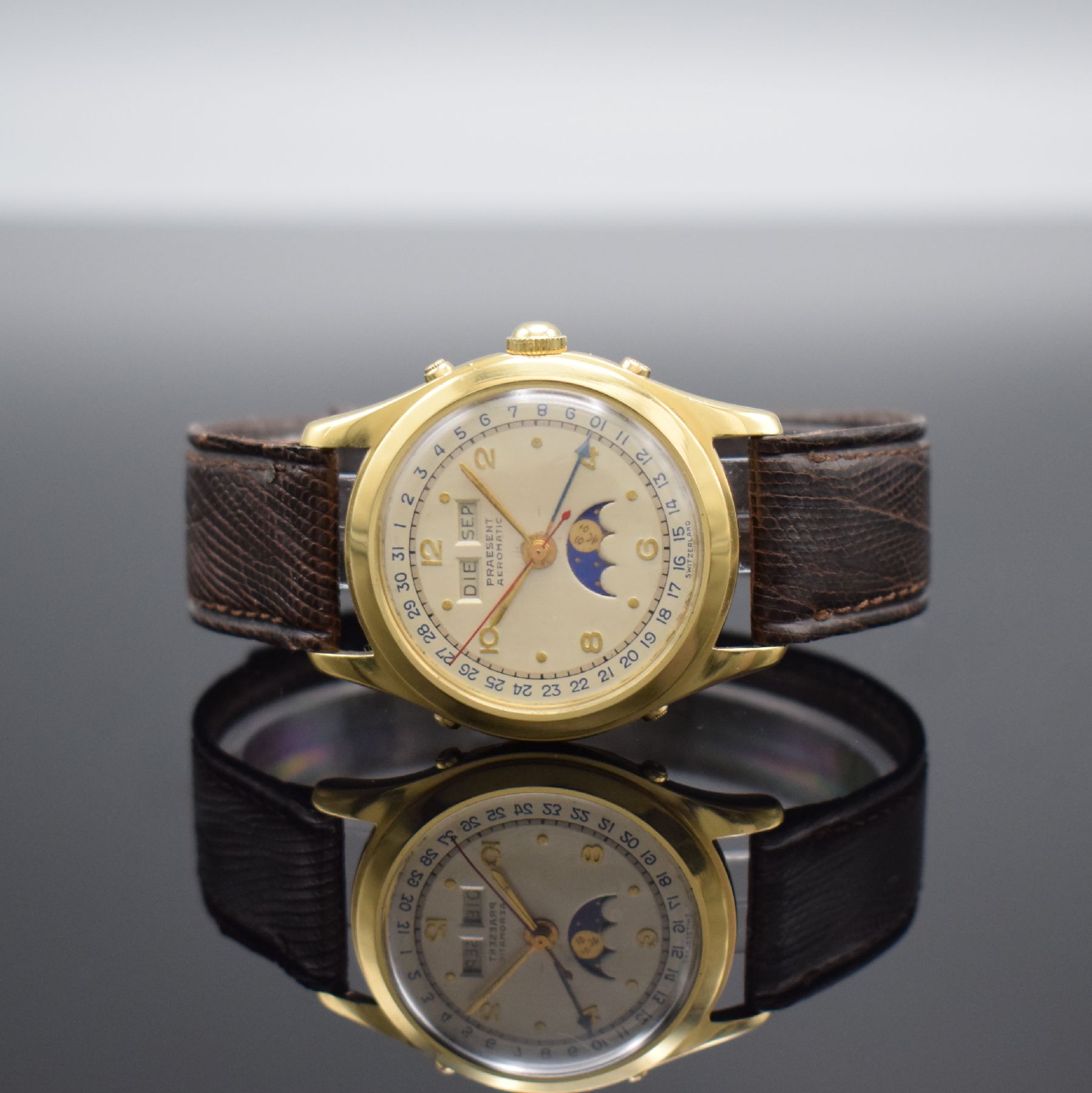 PRAESENT Automatik seltene hochwertige Armbanduhr mit Vollkalender/Mondphase in GG 750/000, Schweiz um 1945, Hammerautomatik, verschr. Geh., silb. ...